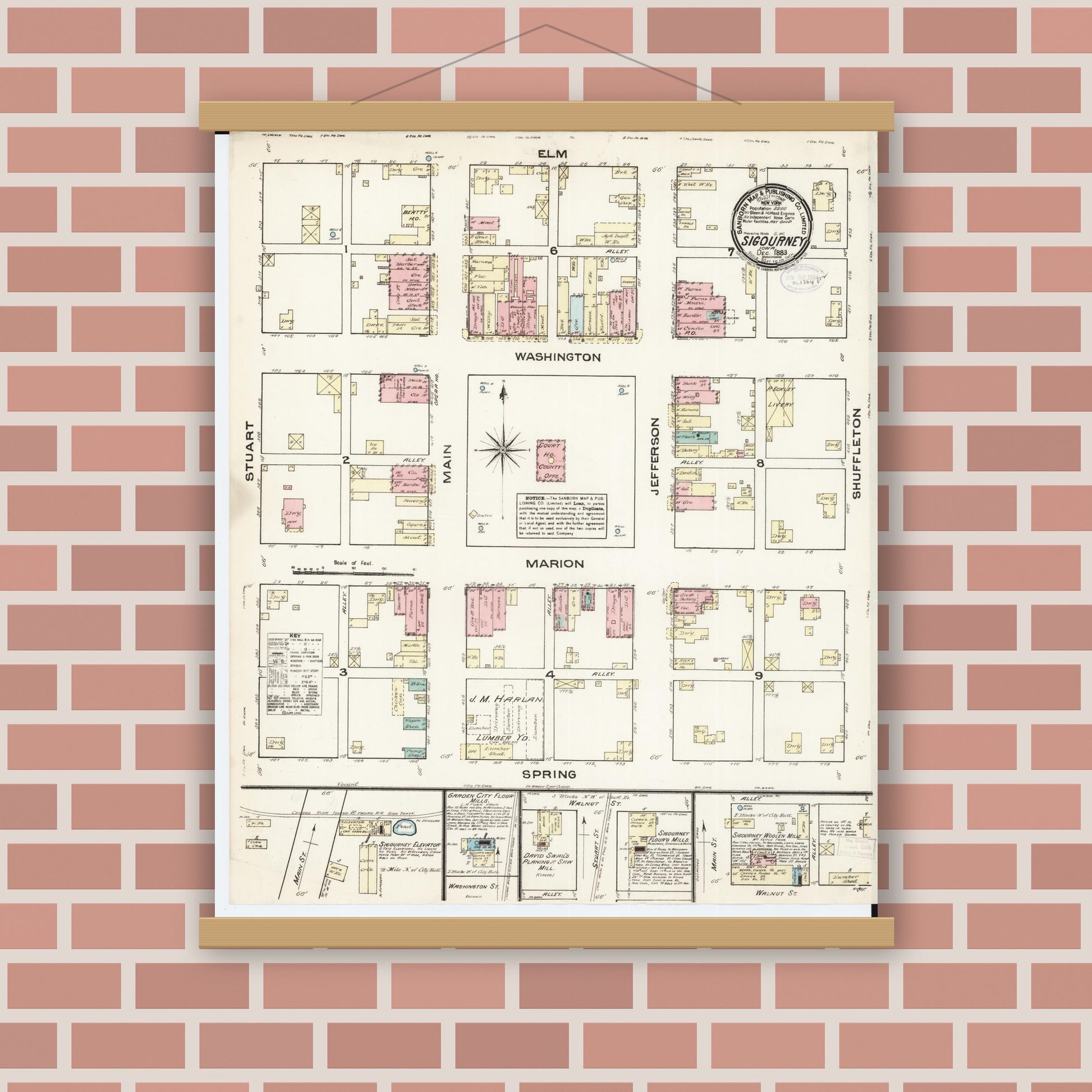Old map wall art mockup — magnetic wood frame on brick wall — Sanborn Fire Insurance Map from Sigourney, Kiokuk County, Iowa (1883), Sheet #0001