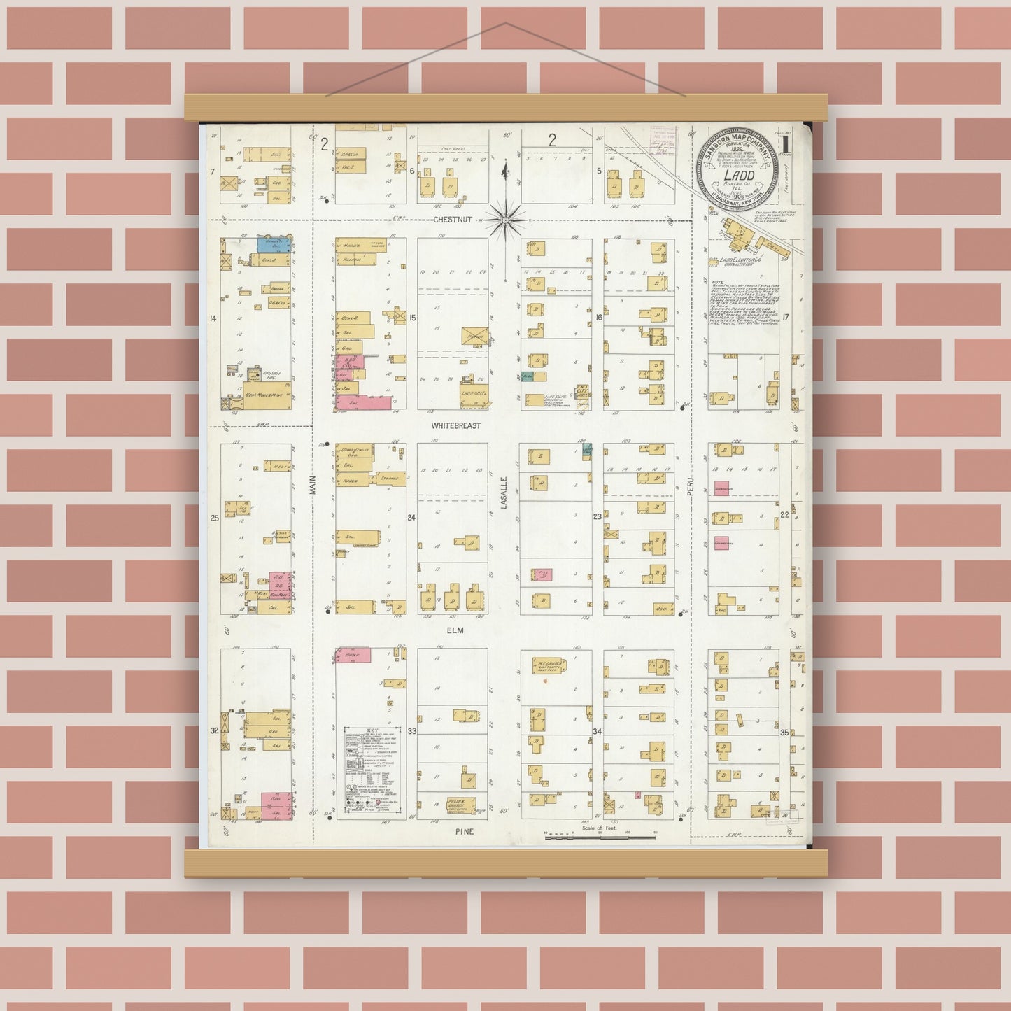 Old map wall art mockup — magnetic wood frame on brick wall — Sanborn Fire Insurance Map from Ladd, Bureau County, Illinois (1906), Sheet #0001
