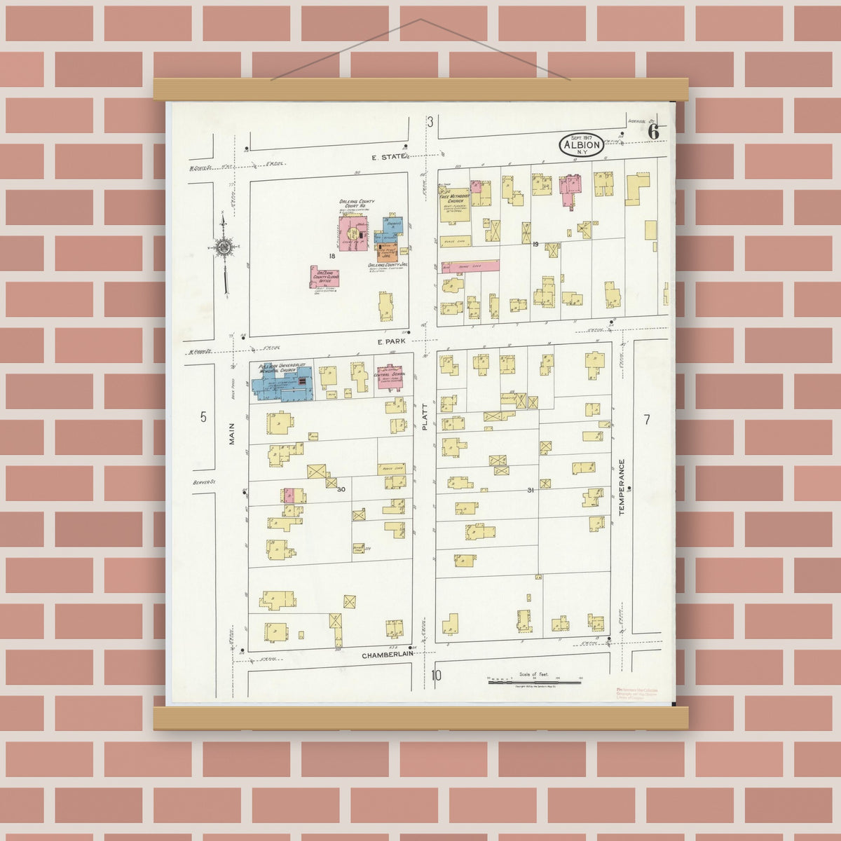 Old map wall art mockup — magnetic wood frame on brick wall — Sanborn Fire Insurance Map from Albion, Orleans County, New York (1917), Sheet #0006