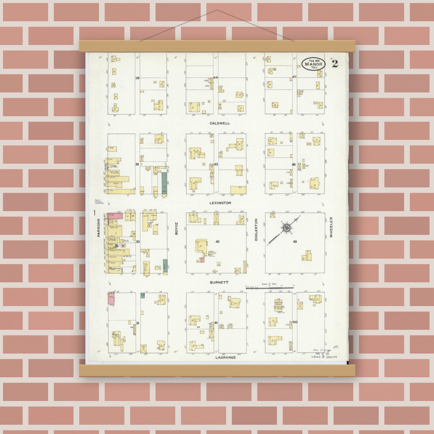 Old map wall art mockup — magnetic wood frame on brick wall — Sanborn Fire Insurance Map from Manor, Travis County, Texas (1910), Sheet #0002