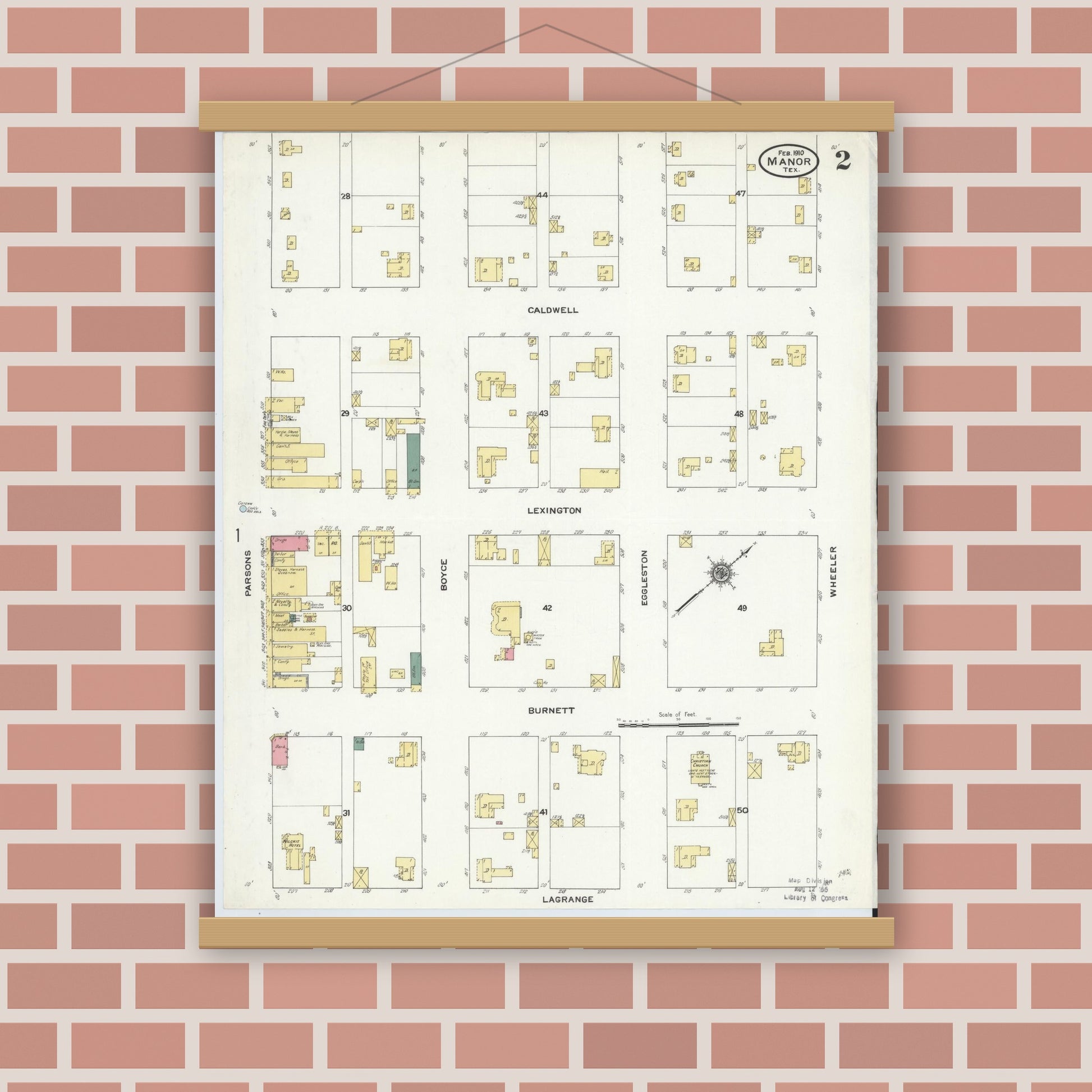 Old map wall art mockup — magnetic wood frame on brick wall — Sanborn Fire Insurance Map from Manor, Travis County, Texas (1910), Sheet #0002