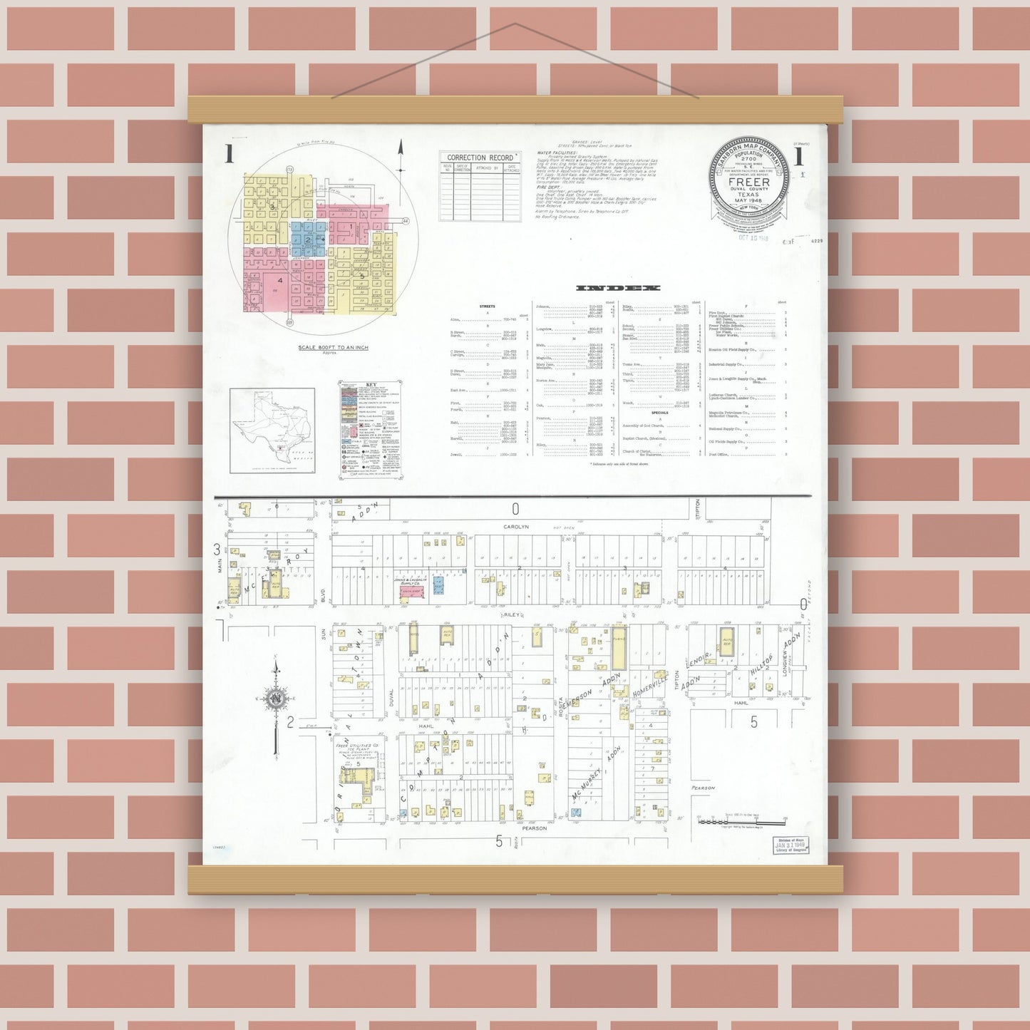 Old map wall art mockup — magnetic wood frame on brick wall — Sanborn Fire Insurance Map from Freer, Duval County, Texas (1948) - Complete Map Set