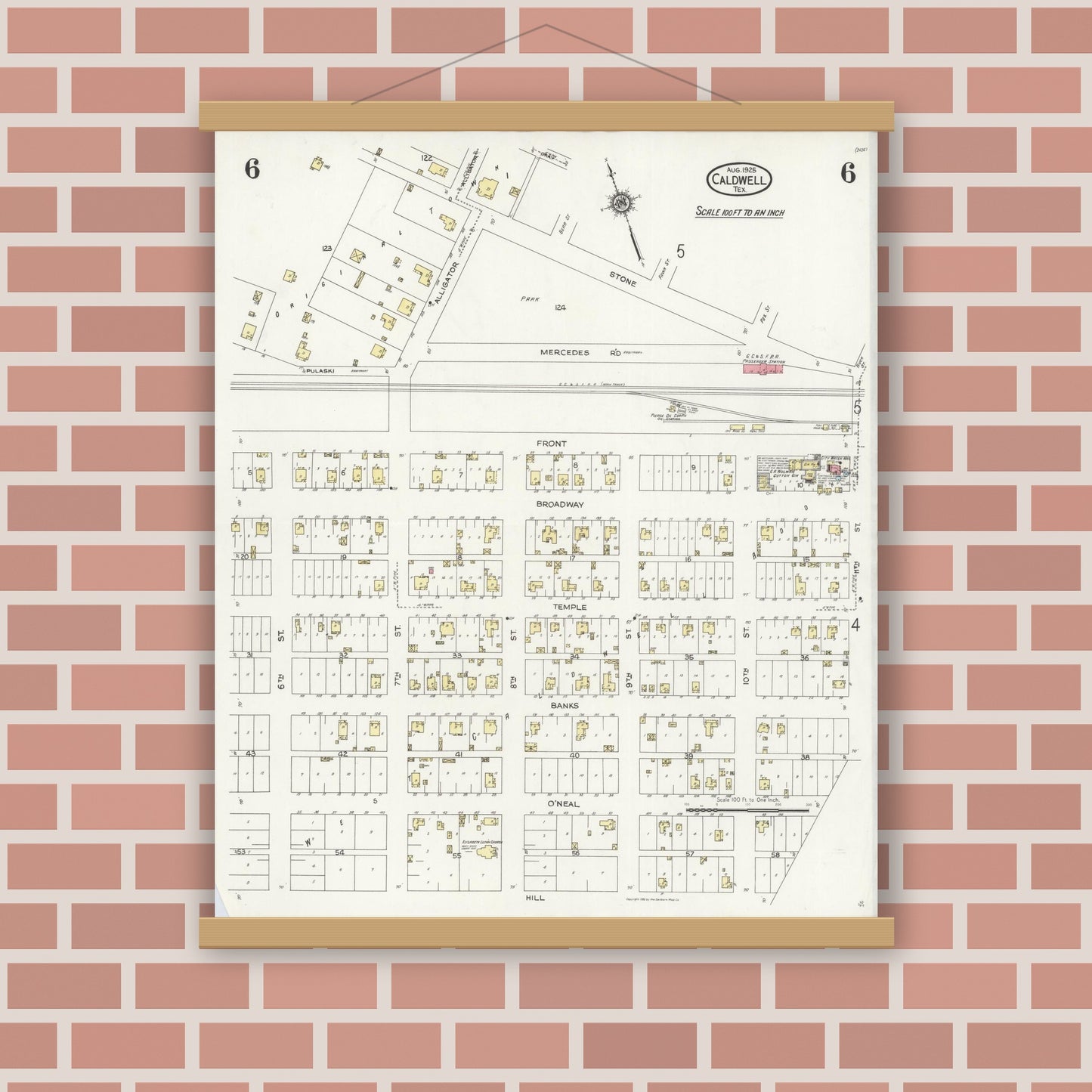 Old map wall art mockup — magnetic wood frame on brick wall — Sanborn Fire Insurance Map from Caldwell, Burleson County, Texas (1925), Sheet #0006