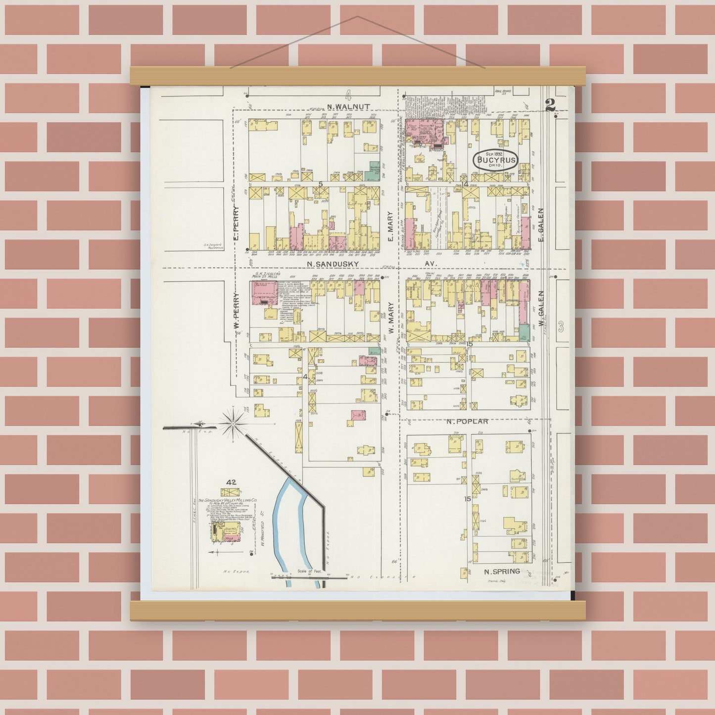 Old map wall art mockup — magnetic wood frame on brick wall — Sanborn Fire Insurance Map from Bucyrus, Crawford County, Ohio (1892), Sheet #0002