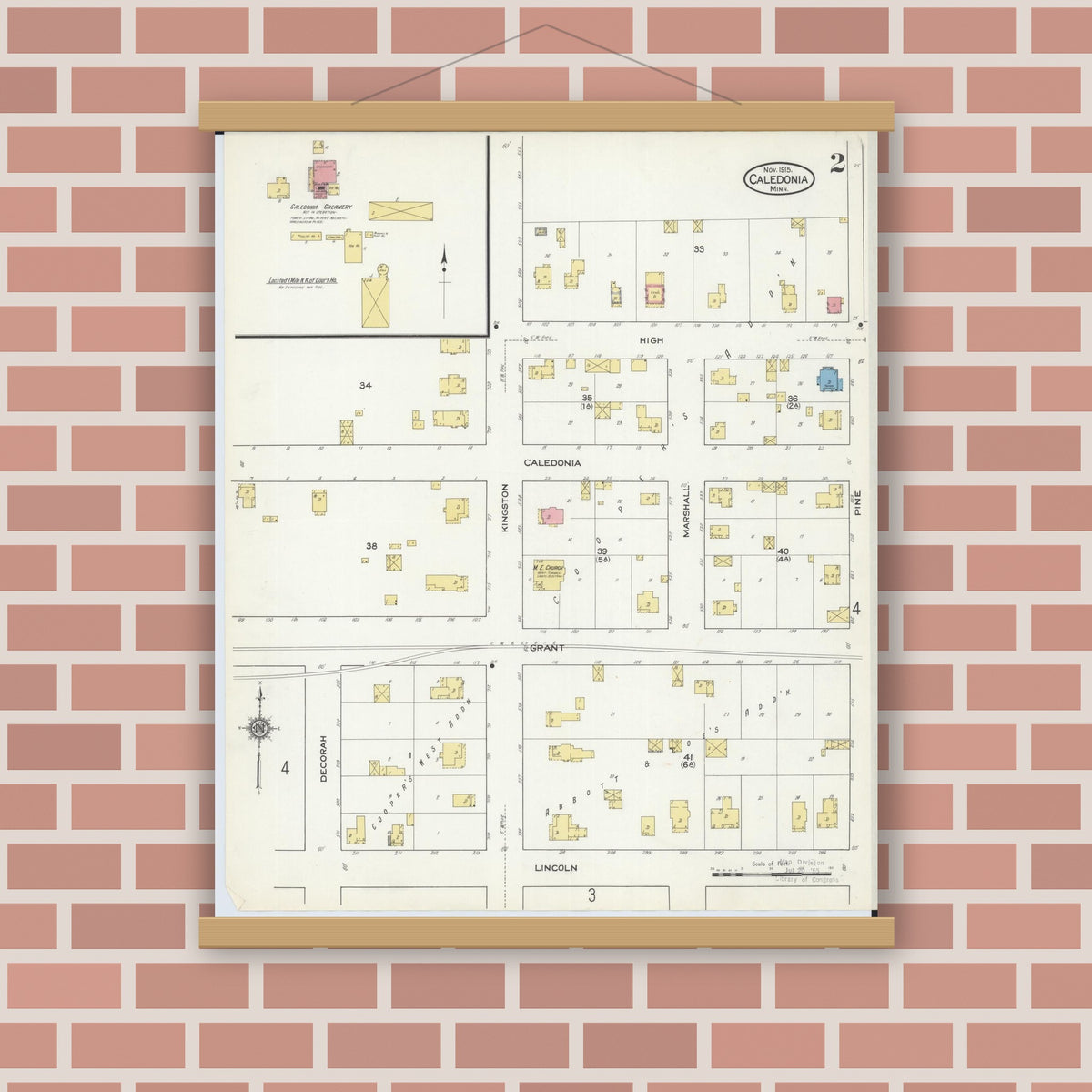 Old map wall art mockup — magnetic wood frame on brick wall — Sanborn Fire Insurance Map from Caledonia, Houston County, Minnesota (1915), Sheet #0002
