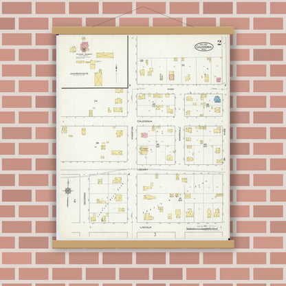 Old map wall art mockup — magnetic wood frame on brick wall — Sanborn Fire Insurance Map from Caledonia, Houston County, Minnesota (1915), Sheet #0002