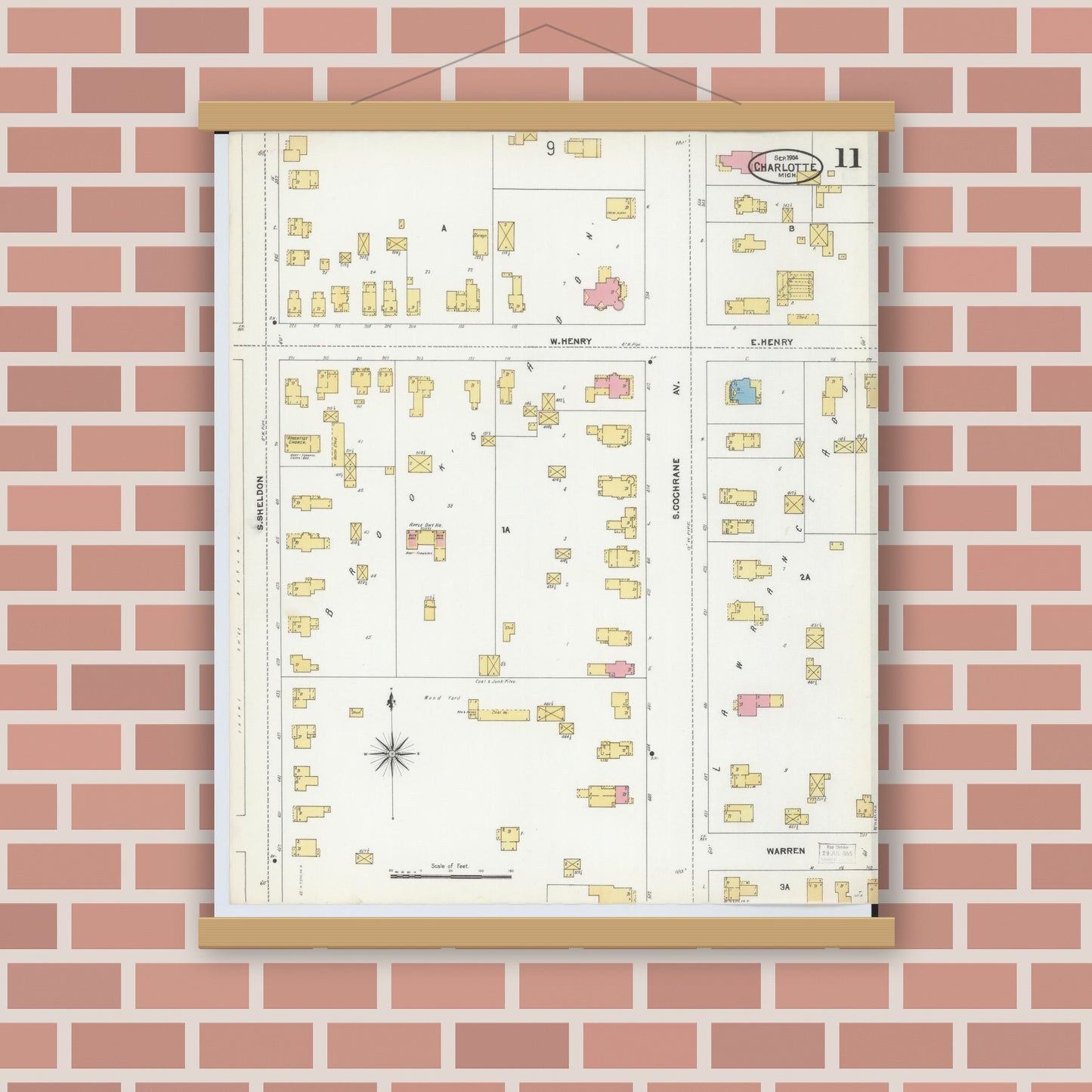Old map wall art mockup — magnetic wood frame on brick wall — Sanborn Fire Insurance Map from Charlotte, Eaton County, Michigan (1904), Sheet #0011