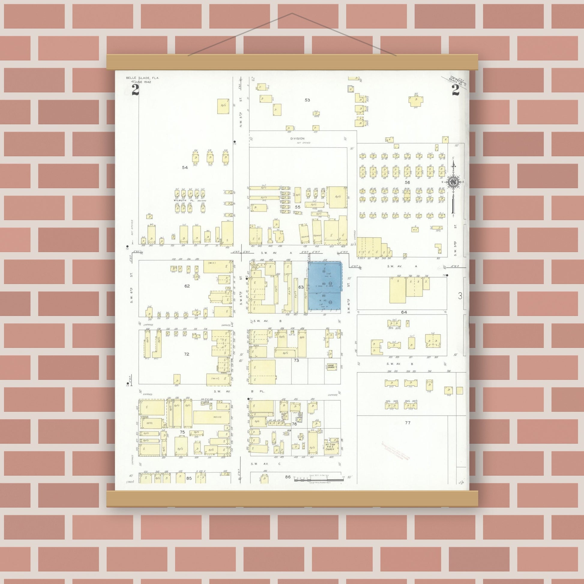 Old map wall art mockup — magnetic wood frame on brick wall — Sanborn Fire Insurance Map from Belle Glade, Palm Beach County, Florida (1942), Sheet #0002