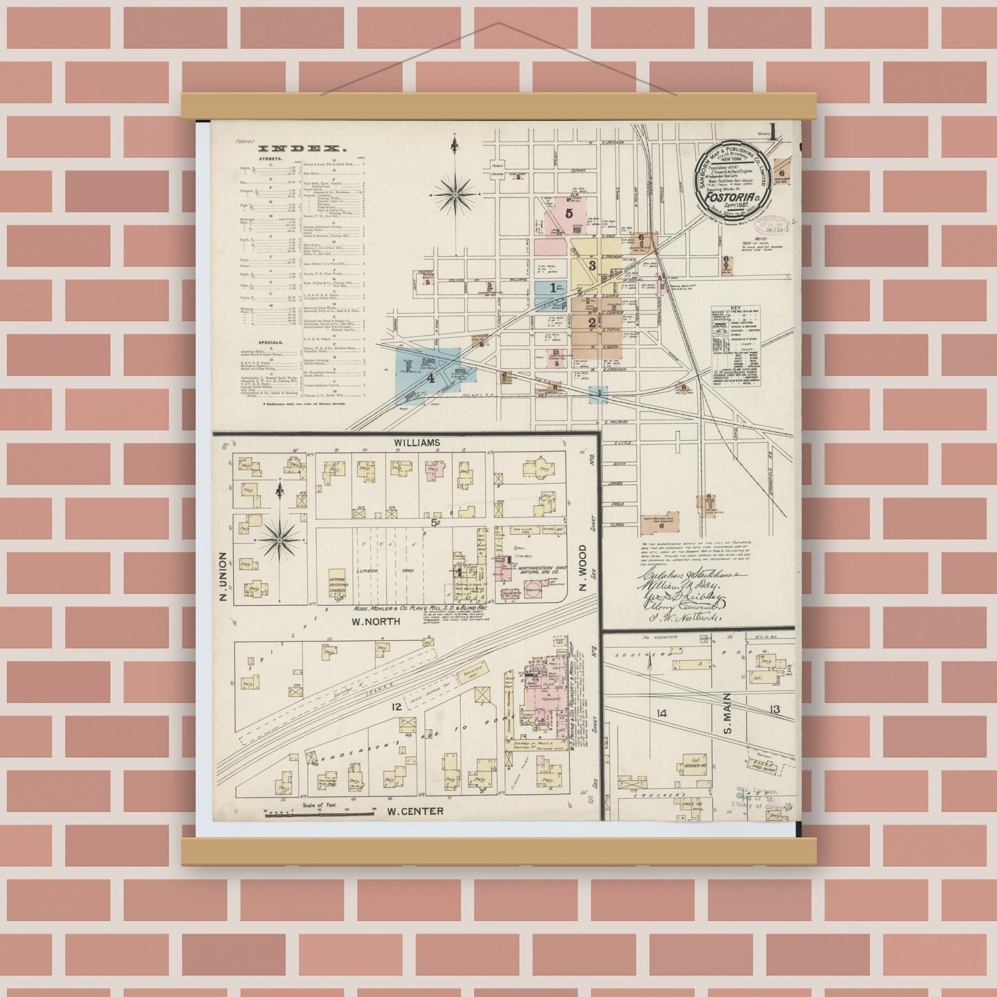 Old map wall art mockup — magnetic wood frame on brick wall — Sanborn Fire Insurance Map from Fostoria, Seneca, Hancock, And Wood Counties, Ohio (1887), Sheet #0001