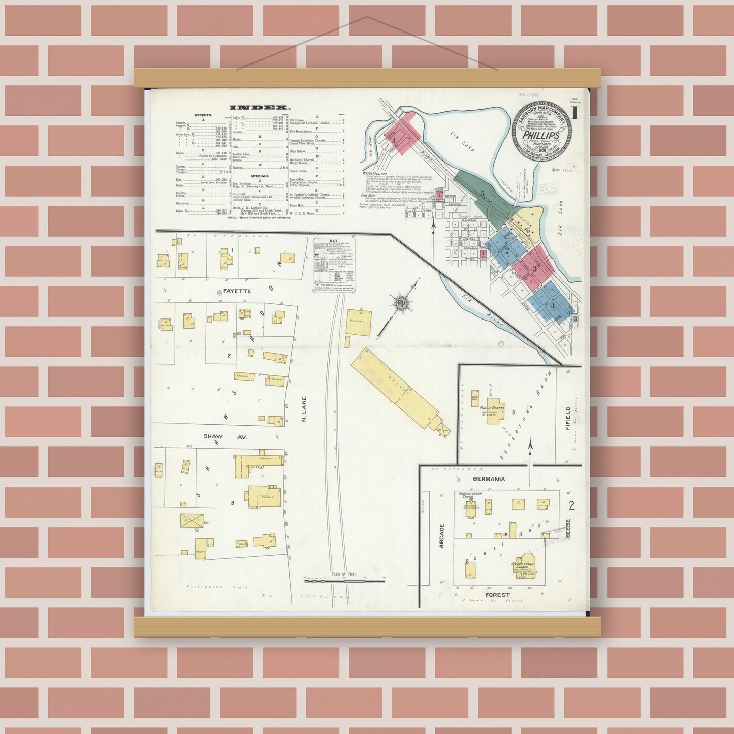 Old map wall art mockup — magnetic wood frame on brick wall — Sanborn Fire Insurance Map from Phillips, Price County, Wisconsin (1909), Sheet #0001