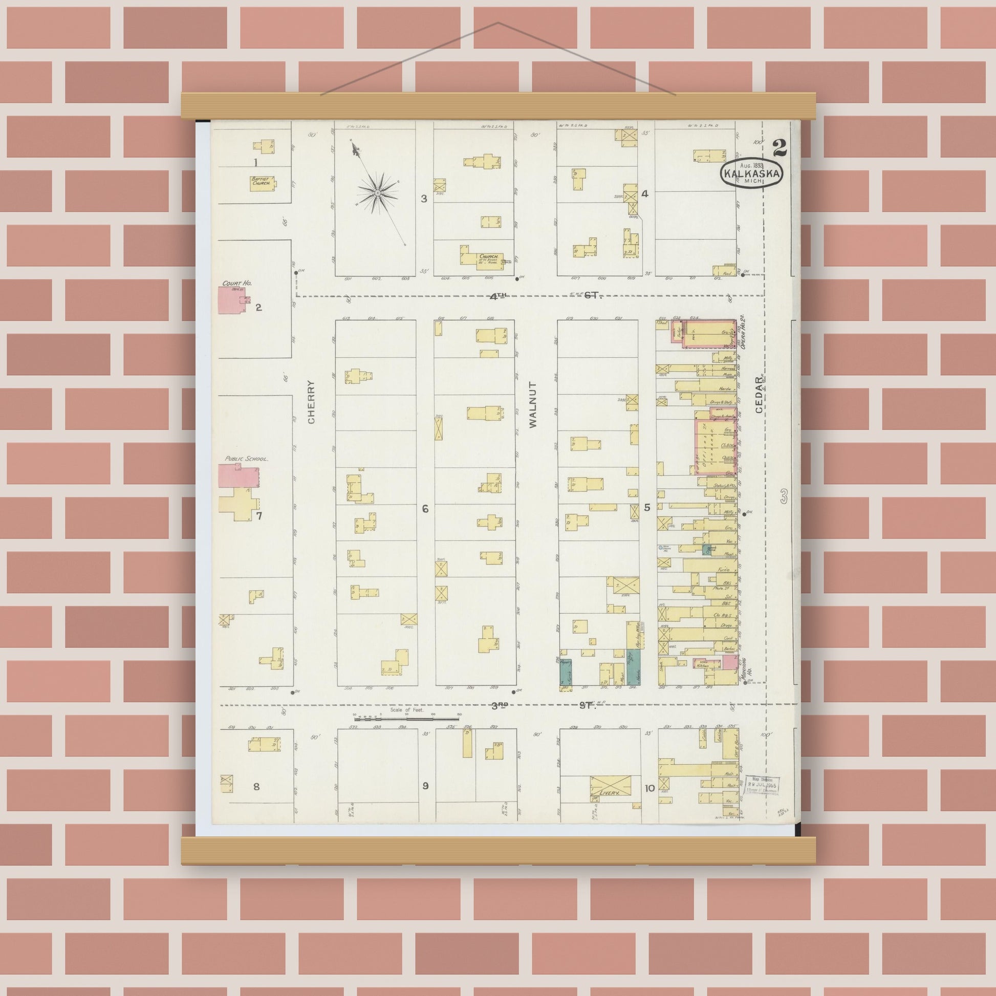 Old map wall art mockup — magnetic wood frame on brick wall — Sanborn Fire Insurance Map from Kalkaska, Kalkaska County, Michigan (1893), Sheet #0002