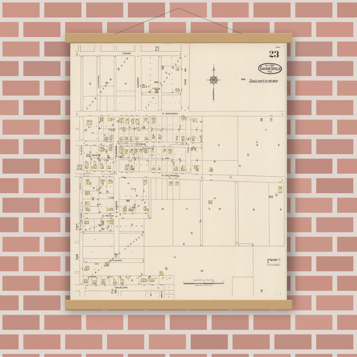 Old map wall art mockup — magnetic wood frame on brick wall — Sanborn Fire Insurance Map from Gainesville, Cooke County, Texas (1922), Sheet #0023