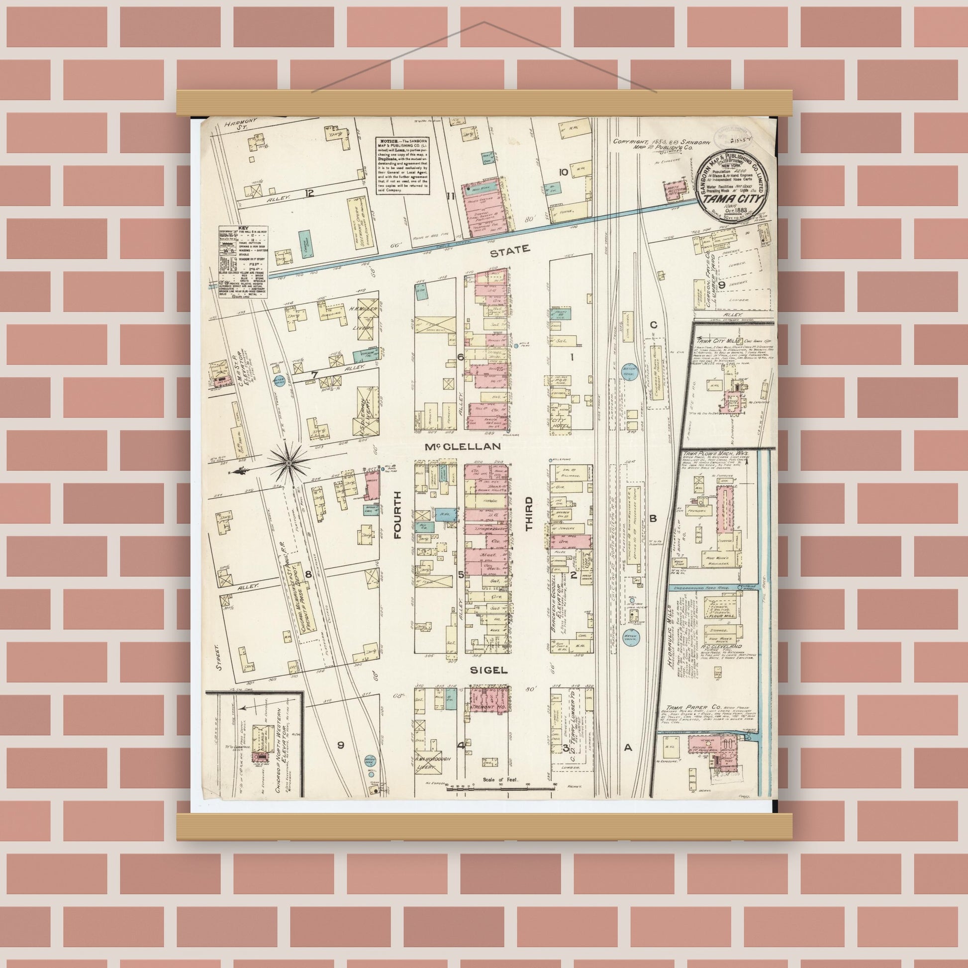 Old map wall art mockup — magnetic wood frame on brick wall — Sanborn Fire Insurance Map from Tama, Tama County, Iowa (1883), Sheet #0001