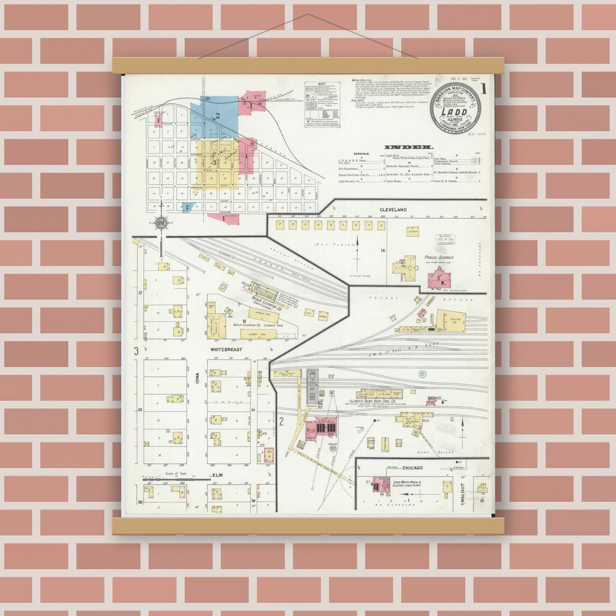 Old map wall art mockup — magnetic wood frame on brick wall — Sanborn Fire Insurance Map from Ladd, Bureau County, Illinois (1911), Sheet #0001