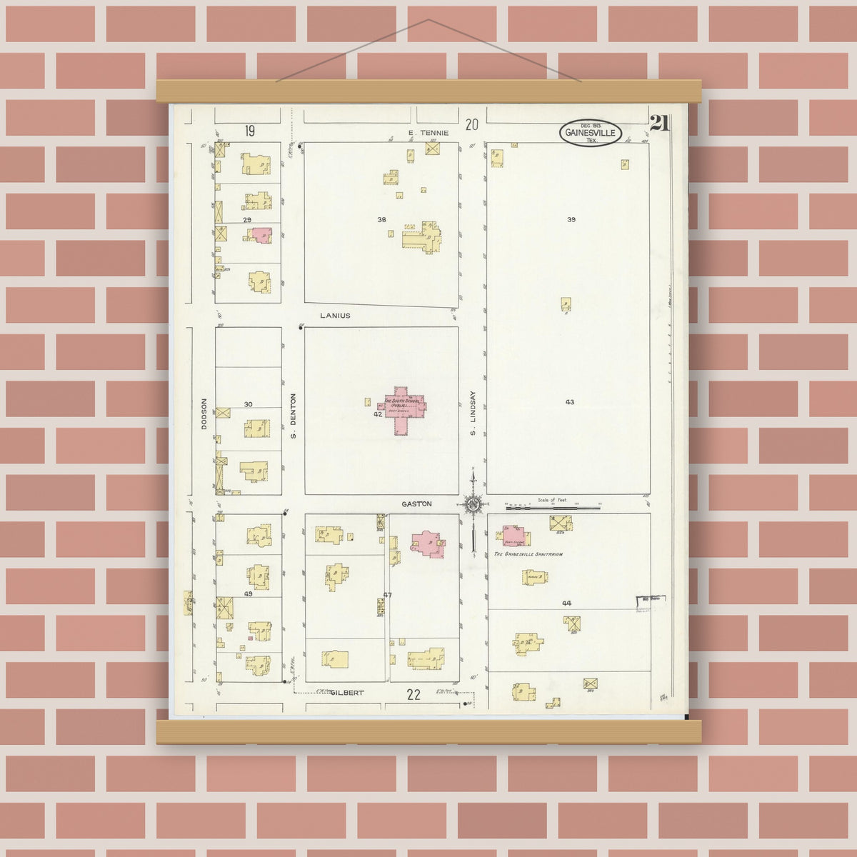 Old map wall art mockup — magnetic wood frame on brick wall — Sanborn Fire Insurance Map from Gainesville, Cooke County, Texas (1913), Sheet #0021