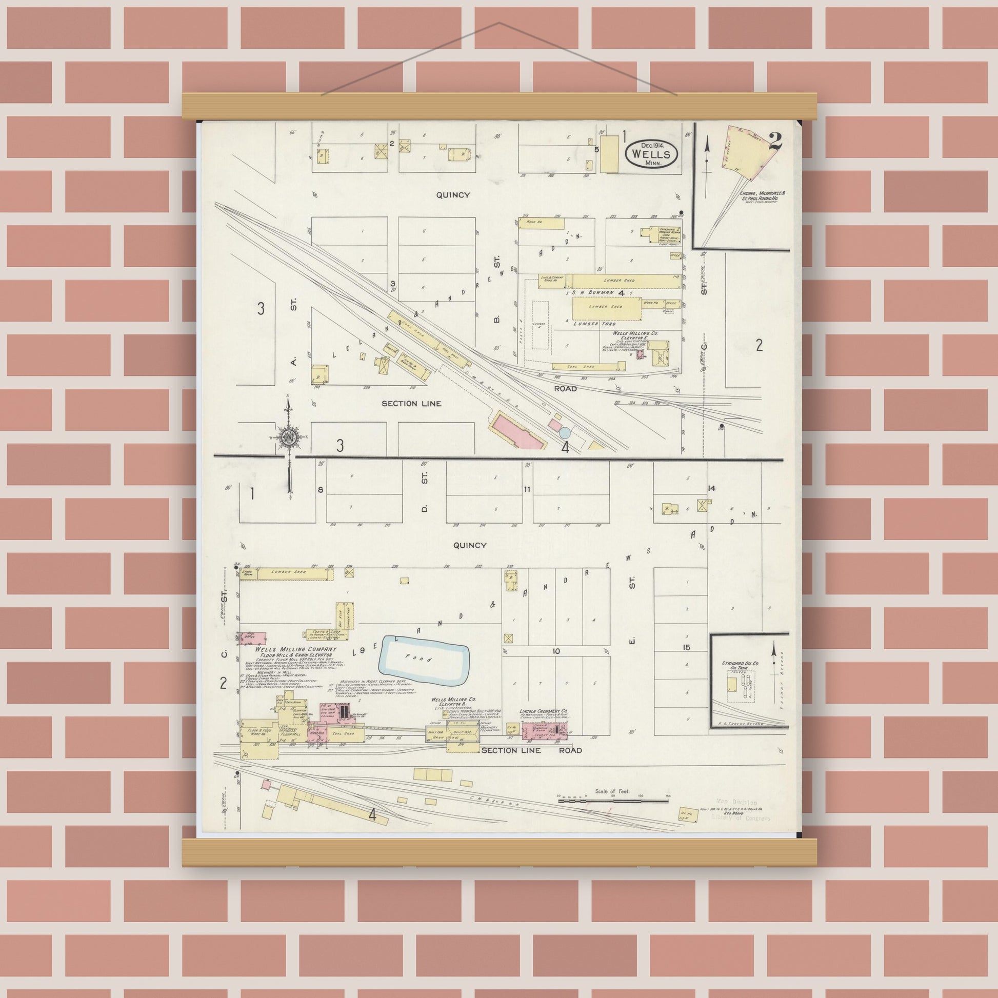 Old map wall art mockup — magnetic wood frame on brick wall — Sanborn Fire Insurance Map from Wells, Faribault County, Minnesota (1914), Sheet #0002