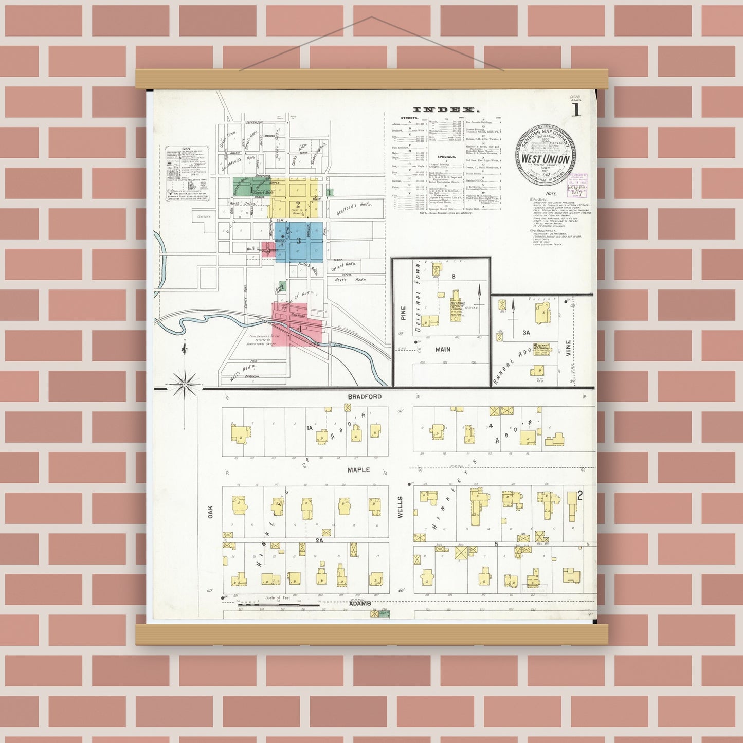 Old map wall art mockup — magnetic wood frame on brick wall — Sanborn Fire Insurance Map from West Union, Fayette County, Iowa (1902), Sheet #0001