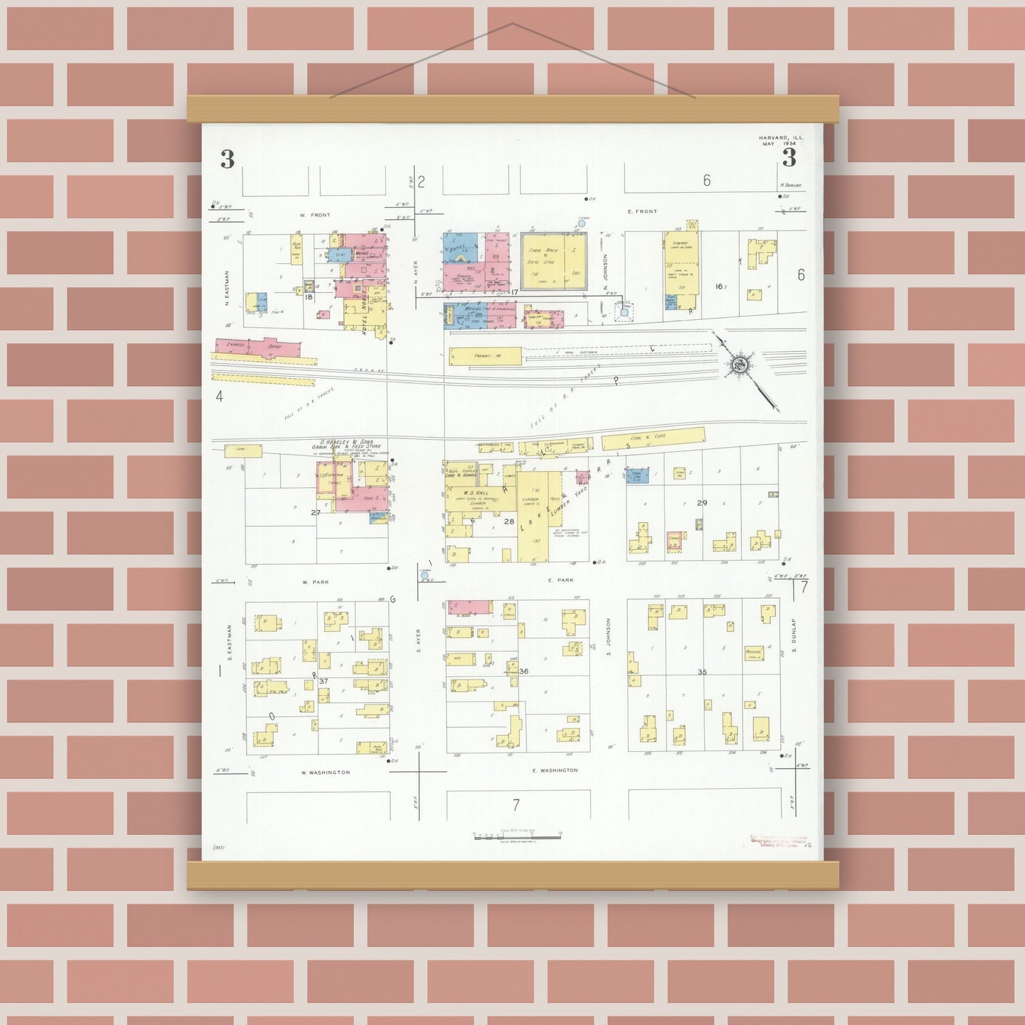 Old map wall art mockup — magnetic wood frame on brick wall — Sanborn Fire Insurance Map from Harvard, McHenry County, Illinois (1934), Sheet #0003
