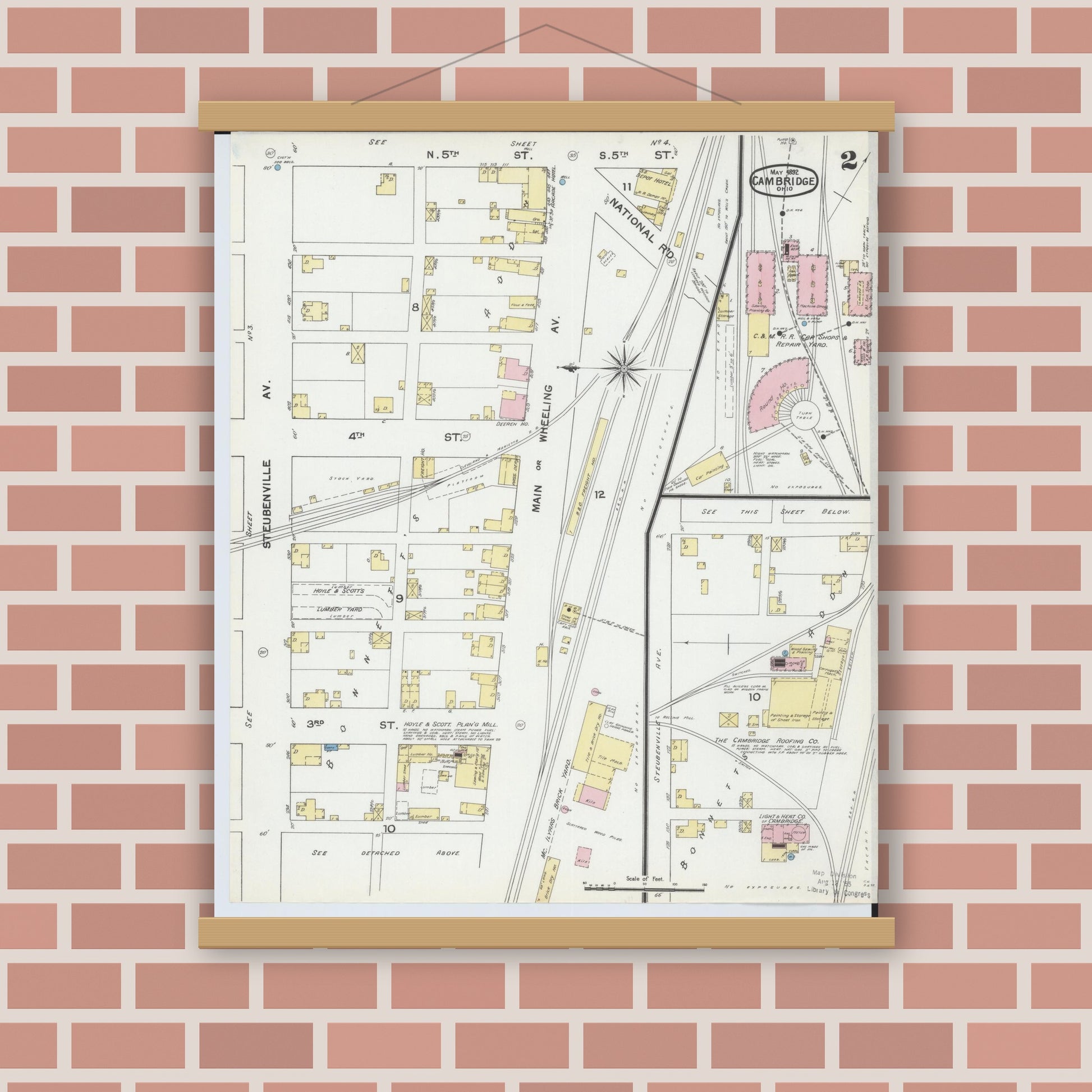 Old map wall art mockup — magnetic wood frame on brick wall — Sanborn Fire Insurance Map from Cambridge, Guernsey County, Ohio (1892), Sheet #0002