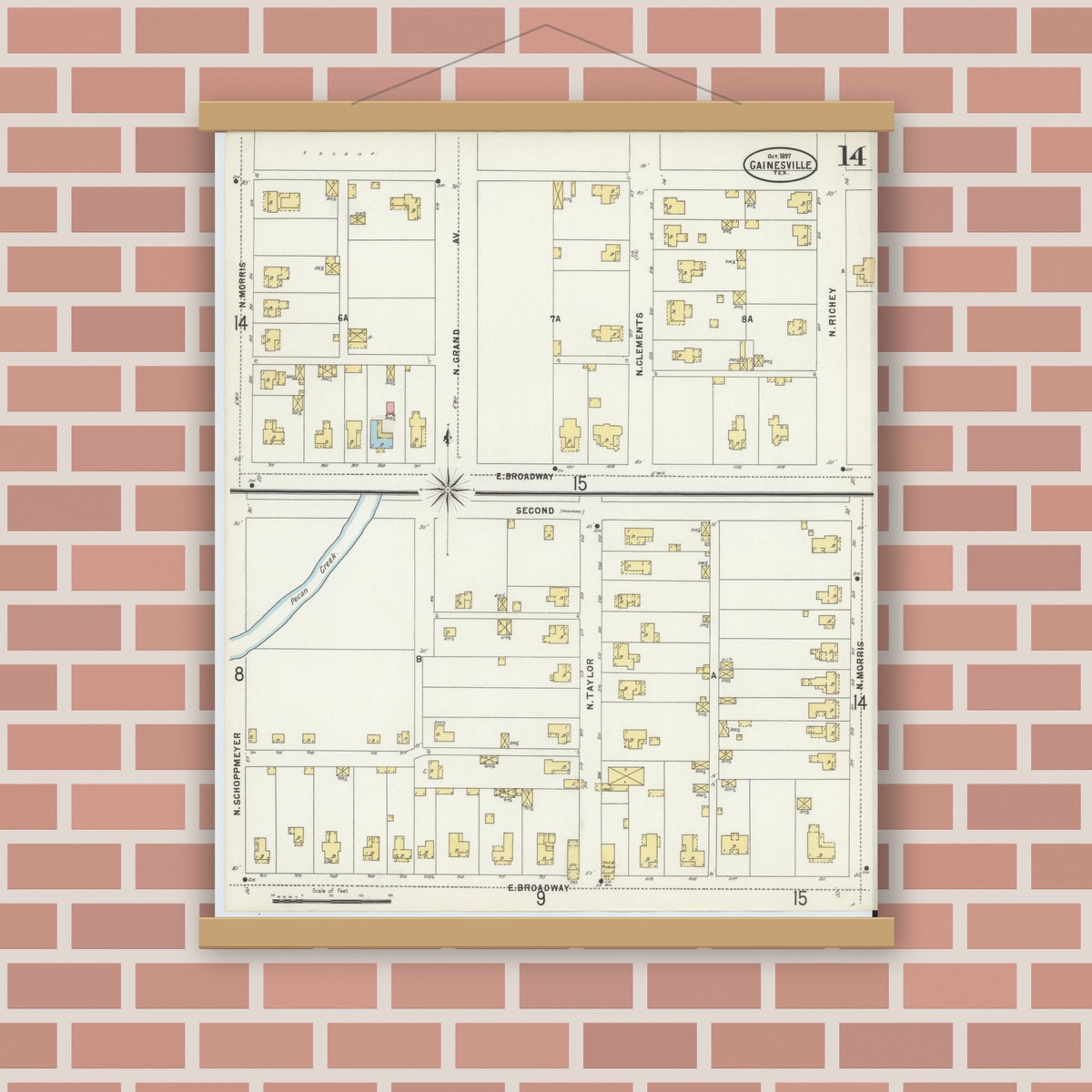 Old map wall art mockup — magnetic wood frame on brick wall — Sanborn Fire Insurance Map from Gainesville, Cooke County, Texas (1897), Sheet #0014