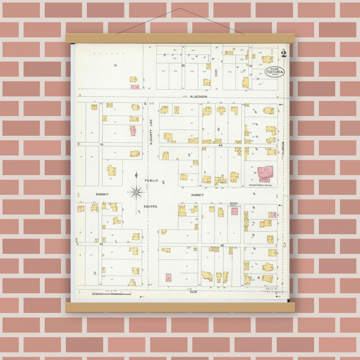 Old map wall art mockup — magnetic wood frame on brick wall — Sanborn Fire Insurance Map from Fostoria, Seneca, Hancock, And Wood Counties, Ohio (1901), Sheet #0002