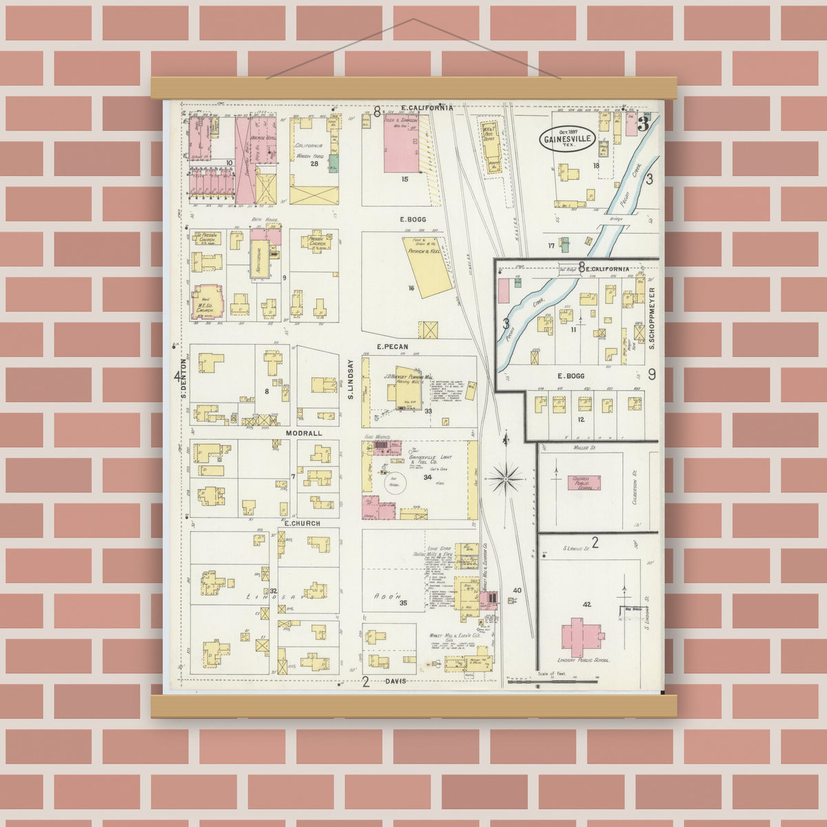 Old map wall art mockup — magnetic wood frame on brick wall — Sanborn Fire Insurance Map from Gainesville, Cooke County, Texas (1897), Sheet #0003