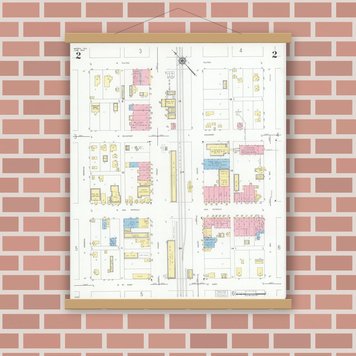 Old map wall art mockup — magnetic wood frame on brick wall — Sanborn Fire Insurance Map from Mathis, San Patricio County, Texas (1950), Sheet #0002