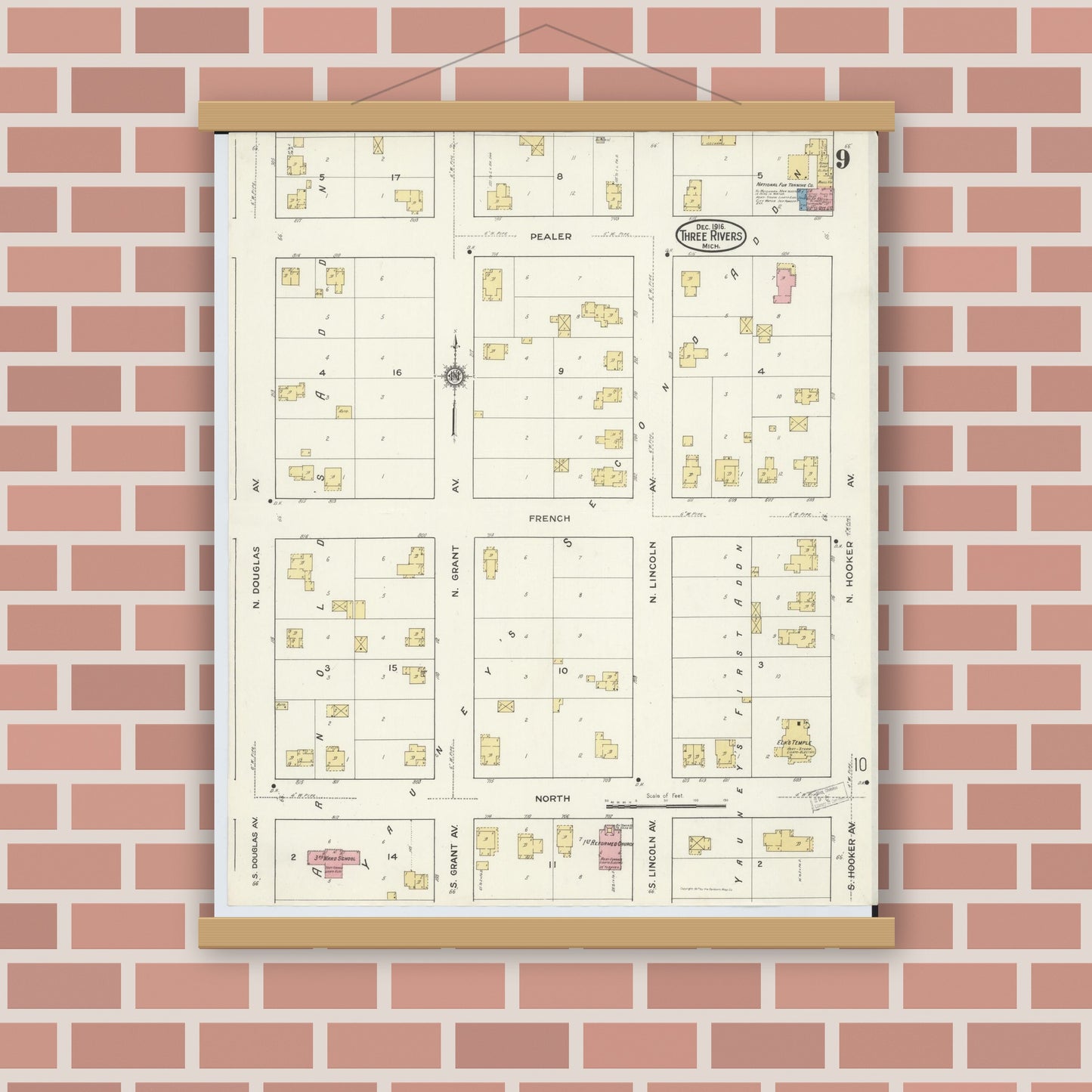 Old map wall art mockup — magnetic wood frame on brick wall — Sanborn Fire Insurance Map from Three Rivers, Saint Joseph County, Michigan (1916), Sheet #0009
