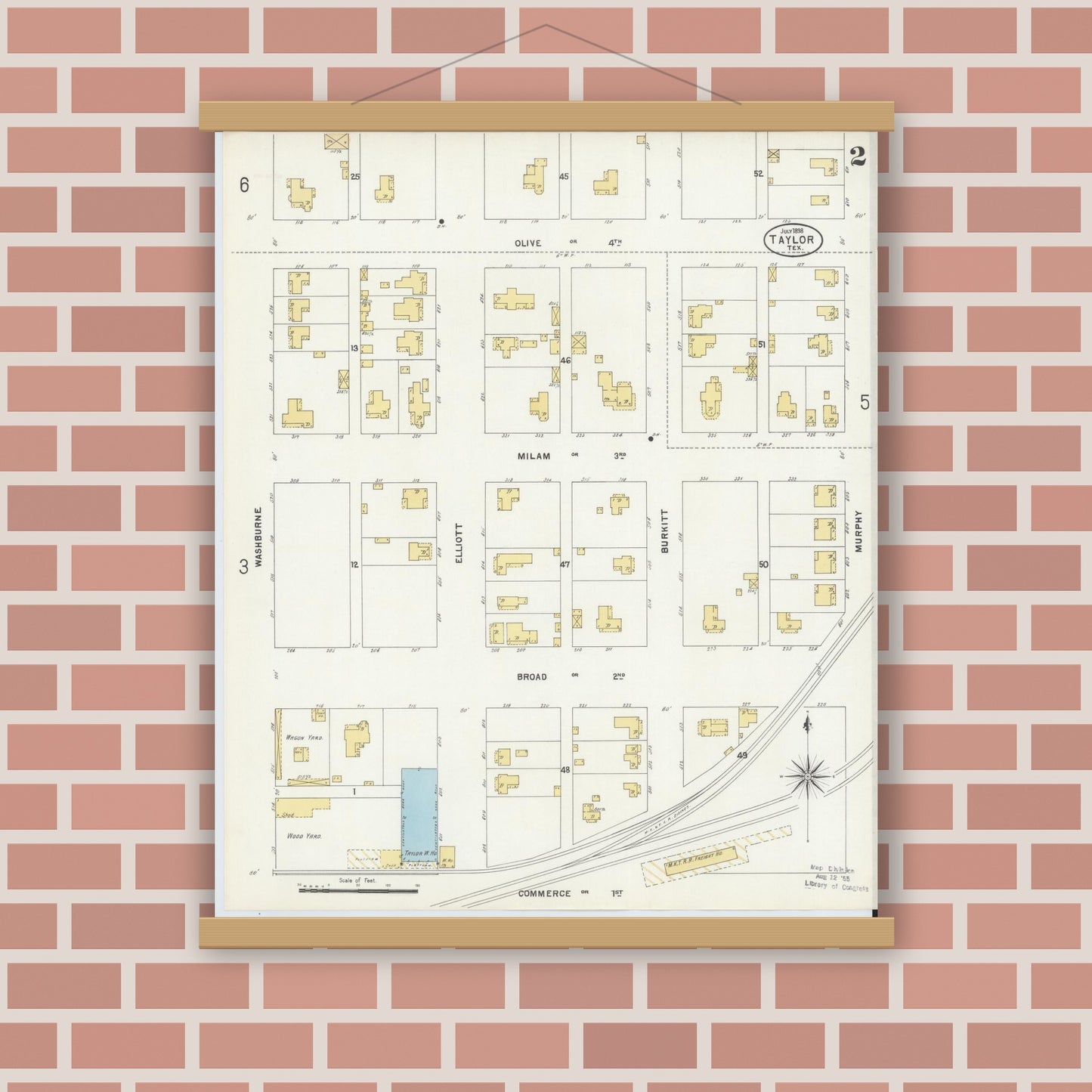 Old map wall art mockup — magnetic wood frame on brick wall — Sanborn Fire Insurance Map from Taylor, Williamson County, Texas (1898), Sheet #0002