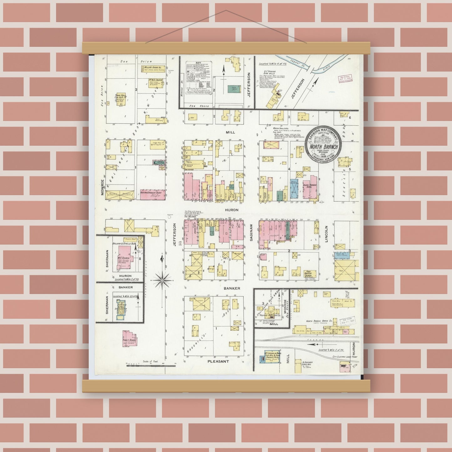 Old map wall art mockup — magnetic wood frame on brick wall — Sanborn Fire Insurance Map from North Branch, Lapeer County, Michigan (1909), Sheet #0001