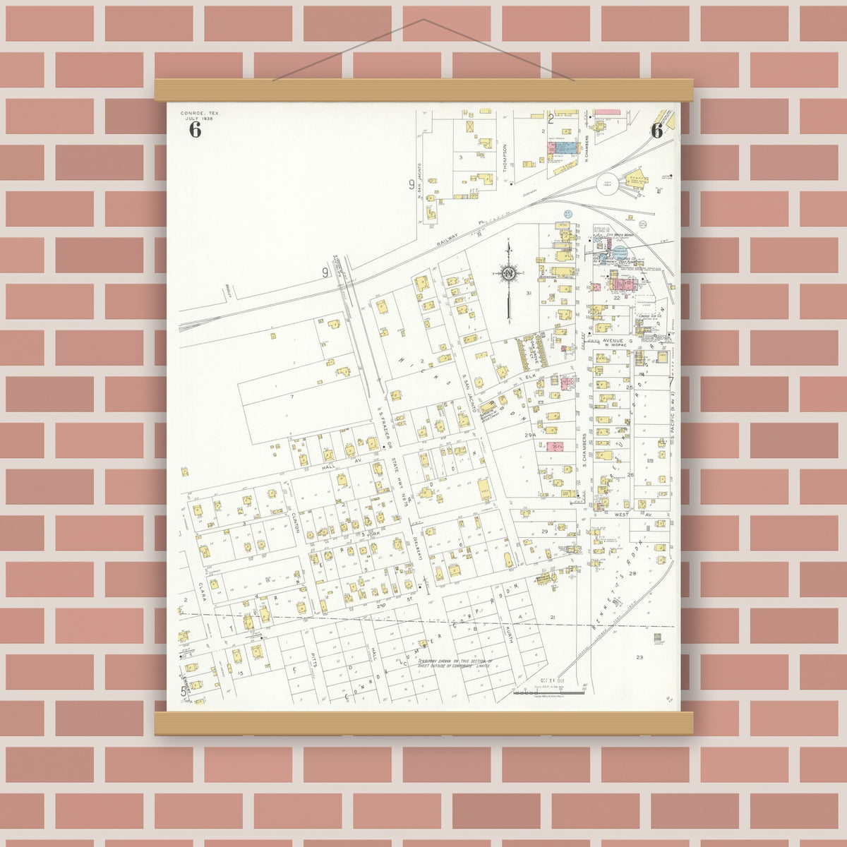 Old map wall art mockup — magnetic wood frame on brick wall — Sanborn Fire Insurance Map from Conroe, Montgomery County, Texas (1938), Sheet #0006