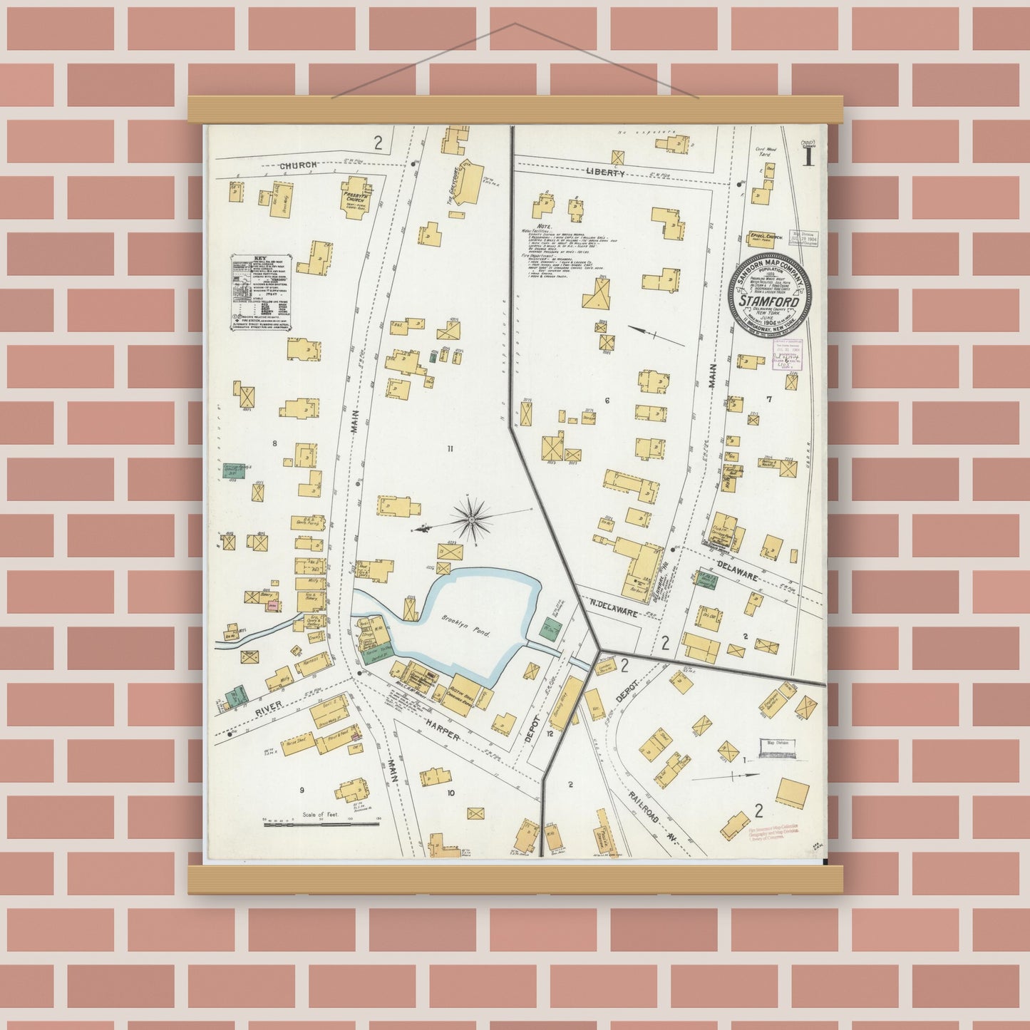 Old map wall art mockup — magnetic wood frame on brick wall — Sanborn Fire Insurance Map from Stamford, Delaware County, New York (1904), Sheet #0001