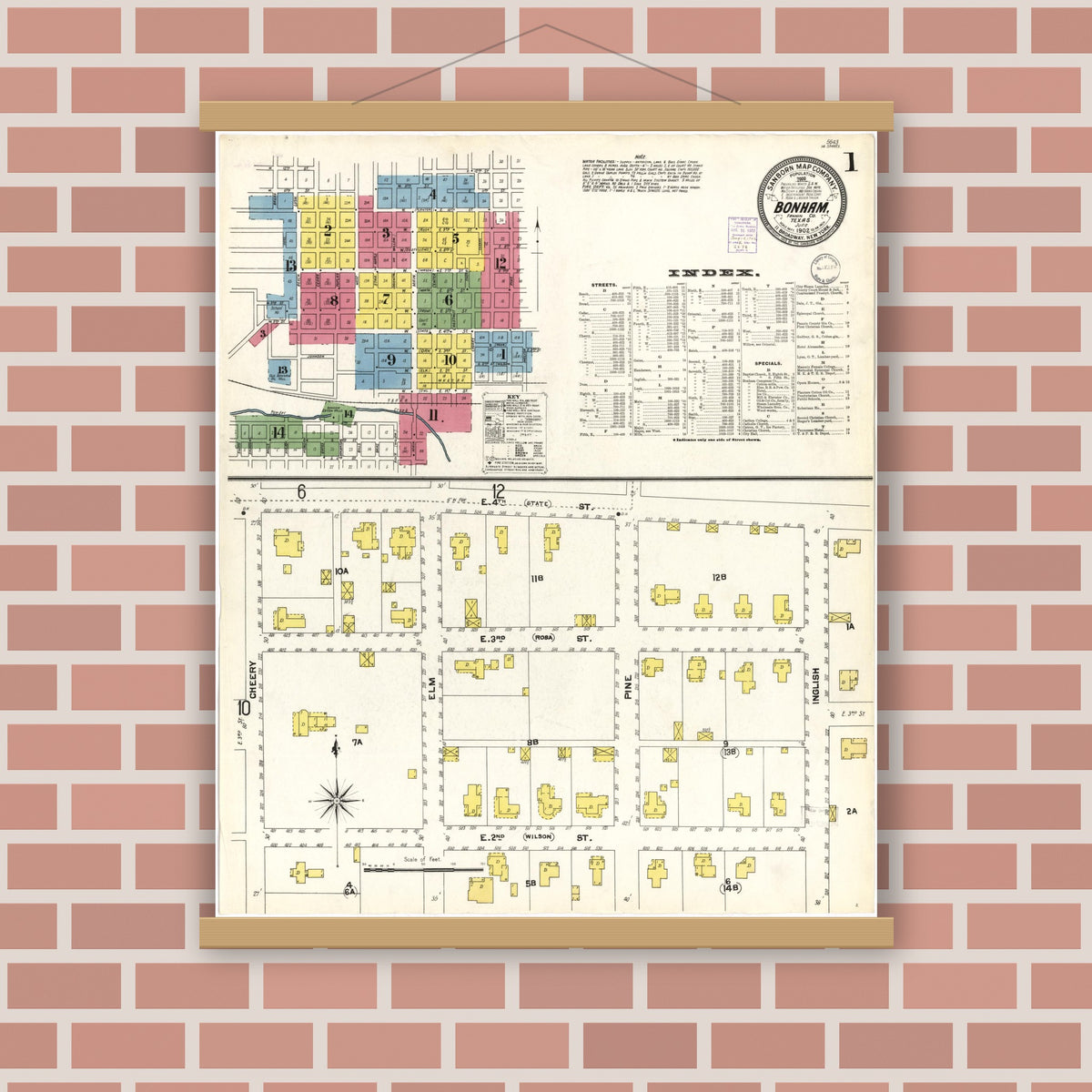 Old map wall art mockup — magnetic wood frame on brick wall — Sanborn Fire Insurance Map from Bonham, Fannin County, Texas (1902), Sheet #0001