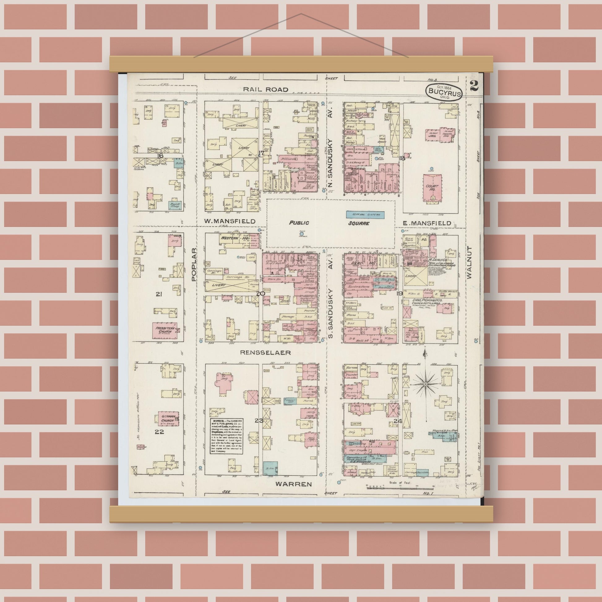 Old map wall art mockup — magnetic wood frame on brick wall — Sanborn Fire Insurance Map from Bucyrus, Crawford County, Ohio (1884), Sheet #0002