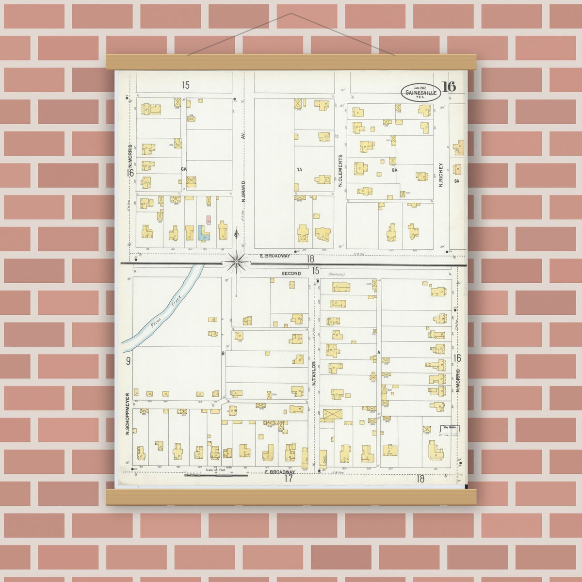 Old map wall art mockup — magnetic wood frame on brick wall — Sanborn Fire Insurance Map from Gainesville, Cooke County, Texas (1902), Sheet #0016