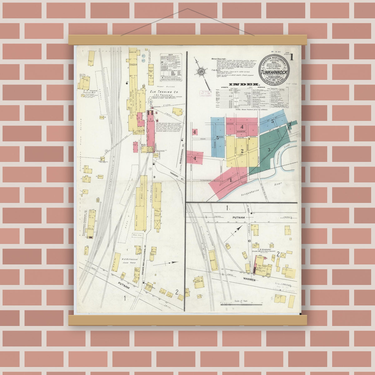 Old map wall art mockup — magnetic wood frame on brick wall — Sanborn Fire Insurance Map from Tunkhannock, Wyoming County, Pennsylvania (1911), Sheet #0001