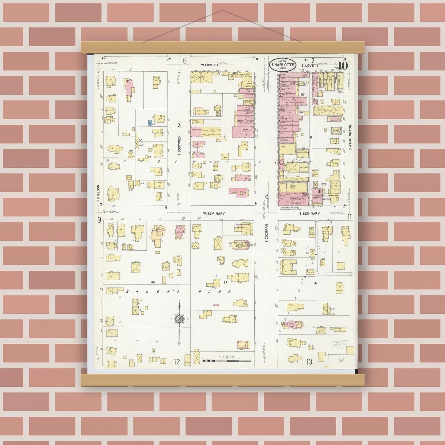 Old map wall art mockup — magnetic wood frame on brick wall — Sanborn Fire Insurance Map from Charlotte, Eaton County, Michigan (1911), Sheet #0010