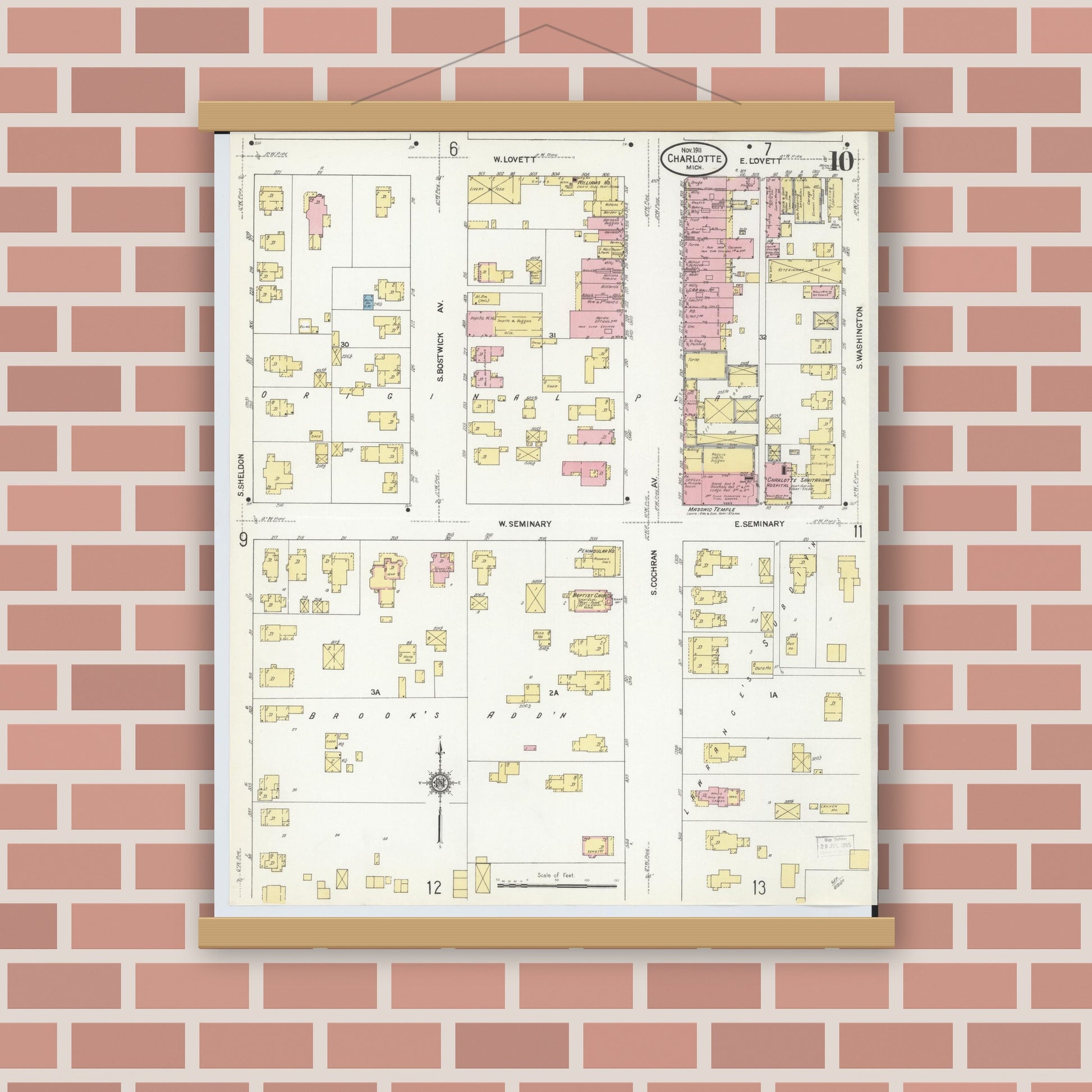 Old map wall art mockup — magnetic wood frame on brick wall — Sanborn Fire Insurance Map from Charlotte, Eaton County, Michigan (1911), Sheet #0010