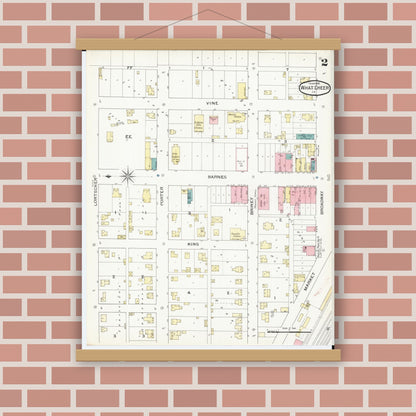 Old map wall art mockup — magnetic wood frame on brick wall — Sanborn Fire Insurance Map from What Cheer, Keokuk County, Iowa (1893), Sheet #0002
