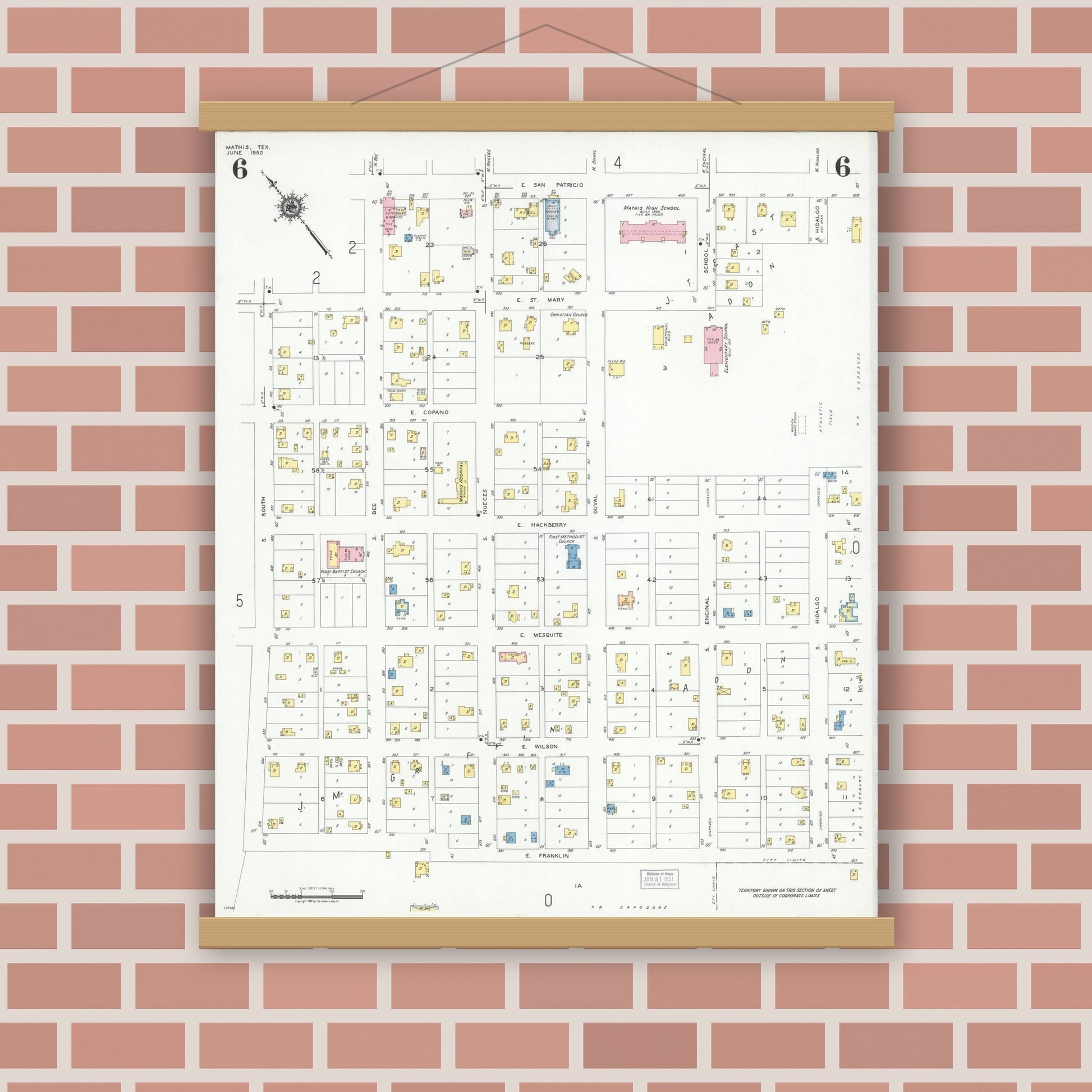 Old map wall art mockup — magnetic wood frame on brick wall — Sanborn Fire Insurance Map from Mathis, San Patricio County, Texas (1950), Sheet #0006