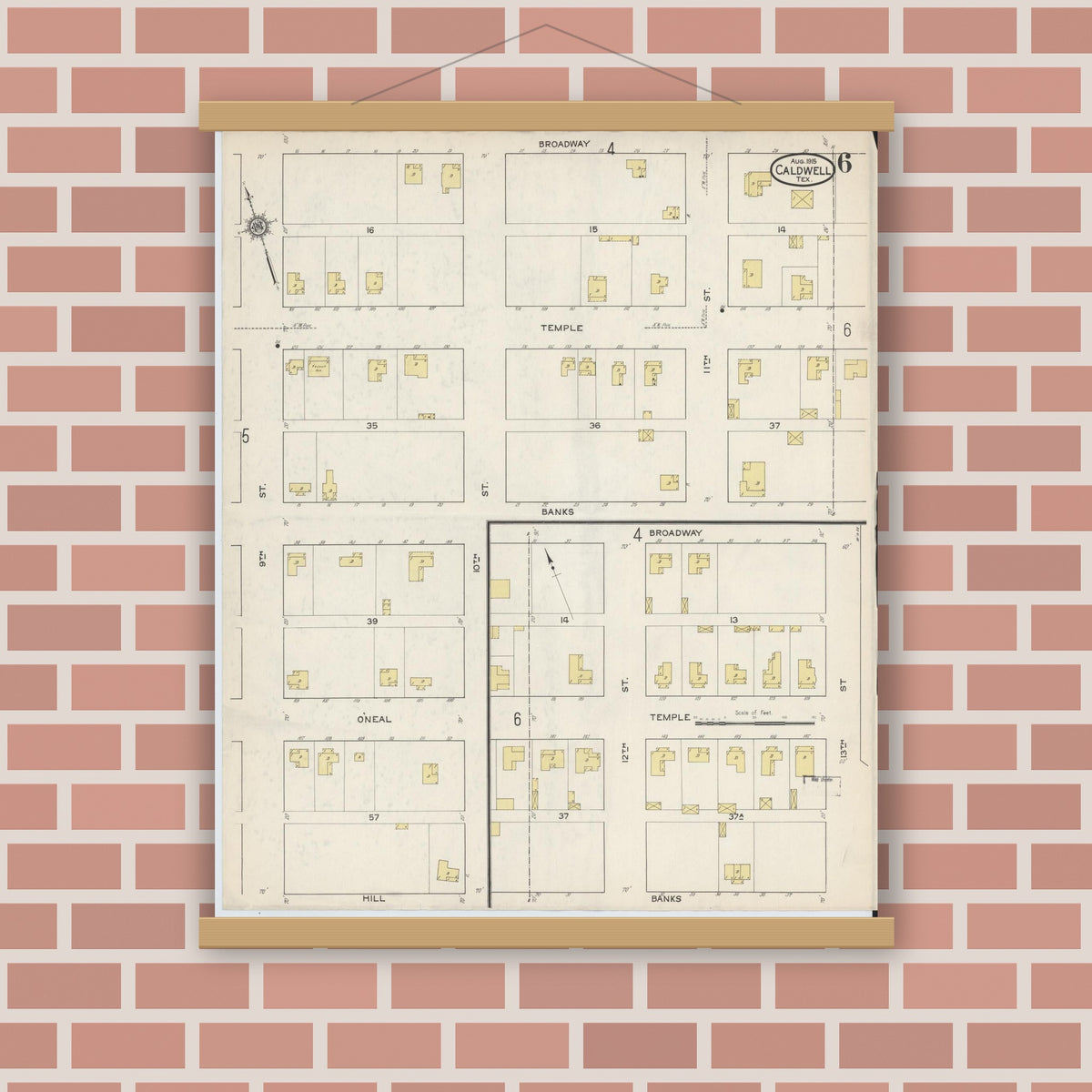 Old map wall art mockup — magnetic wood frame on brick wall — Sanborn Fire Insurance Map from Caldwell, Burleson County, Texas (1915), Sheet #0006