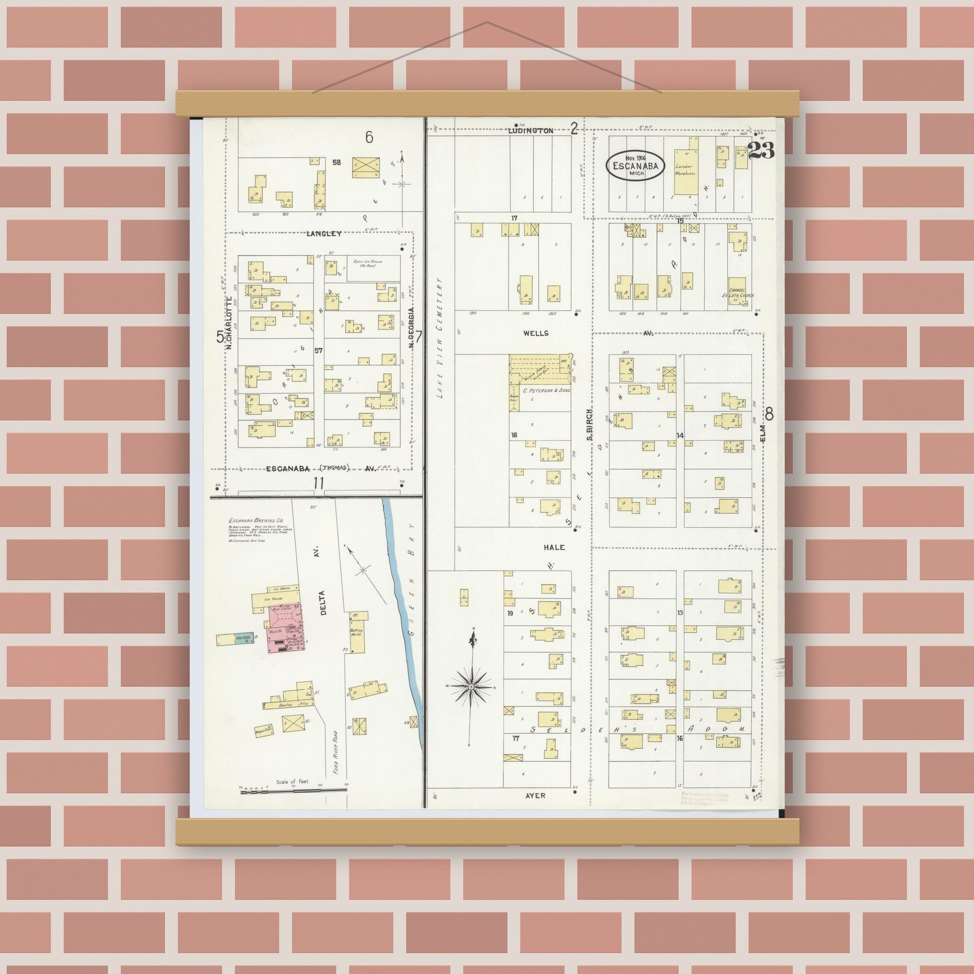 Old map wall art mockup — magnetic wood frame on brick wall — Sanborn Fire Insurance Map from Escanaba, Delta County, Michigan (1906), Sheet #0023