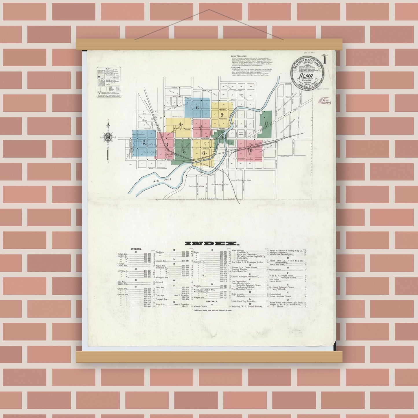 Old map wall art mockup — magnetic wood frame on brick wall — Sanborn Fire Insurance Map from Alma, Gratiot County, Michigan (1910) - Complete Map Set