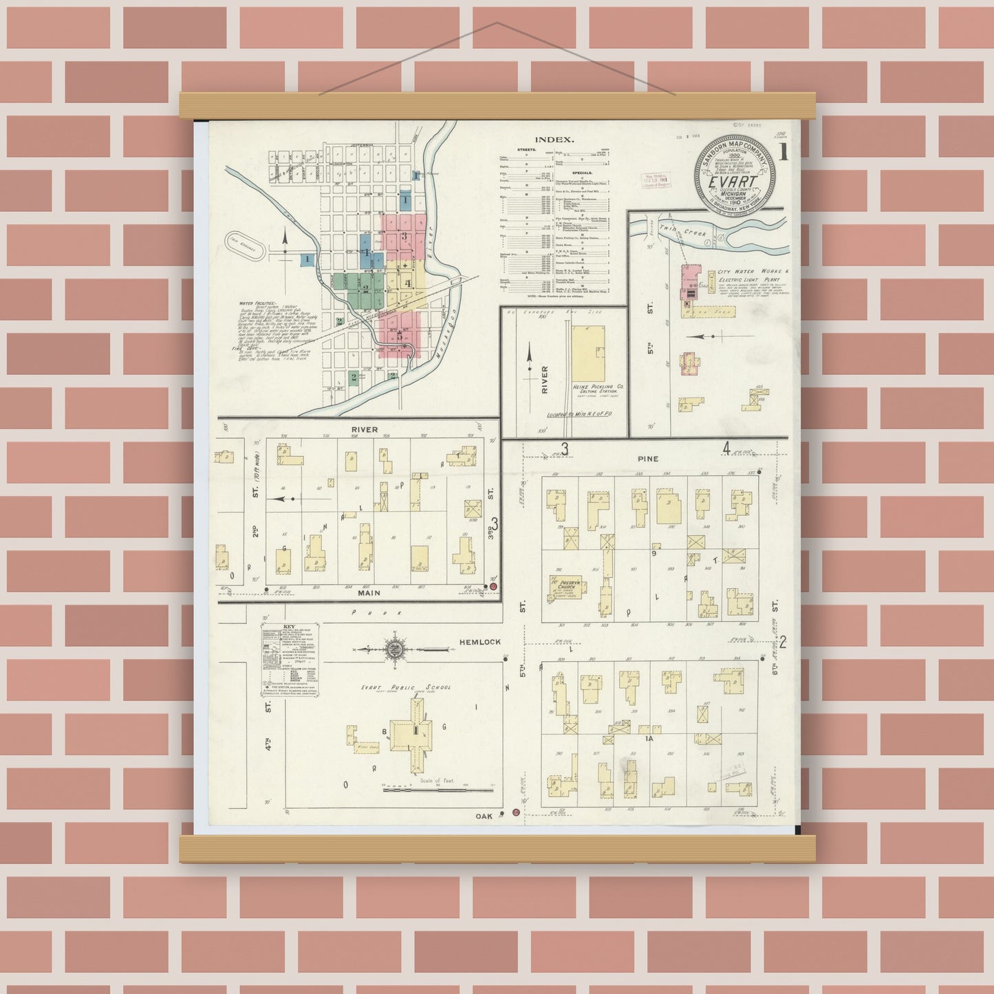 Old map wall art mockup — magnetic wood frame on brick wall — Sanborn Fire Insurance Map from Evart, Osceola County, Michigan (1910), Sheet #0001