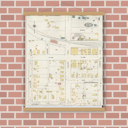 Old map wall art mockup — magnetic wood frame on brick wall — Sanborn Fire Insurance Map from Rensselaer, Jasper County, Indiana (1942), Sheet #0003