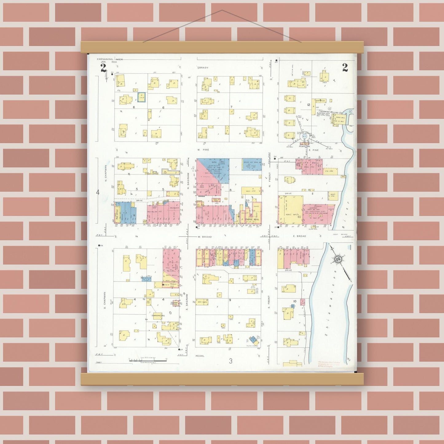Old map wall art mockup — magnetic wood frame on brick wall — Sanborn Fire Insurance Map from Chesaning, Saginaw County, Michigan (1935), Sheet #0002