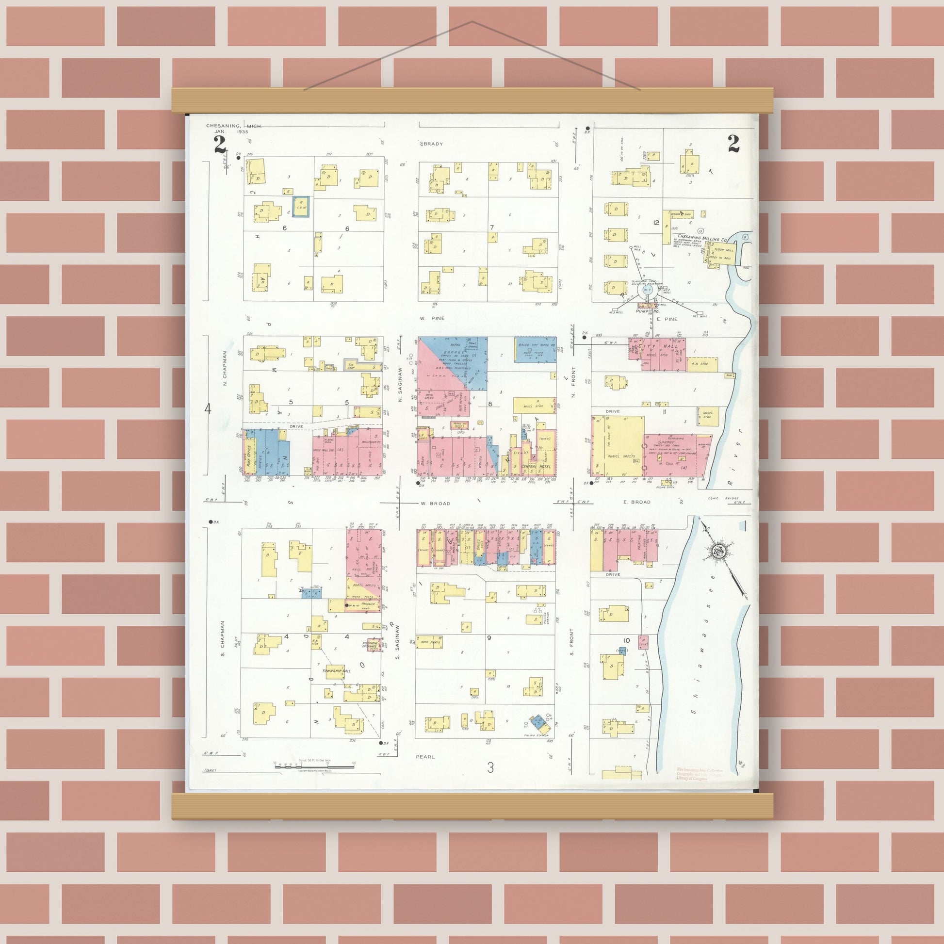 Old map wall art mockup — magnetic wood frame on brick wall — Sanborn Fire Insurance Map from Chesaning, Saginaw County, Michigan (1935), Sheet #0002