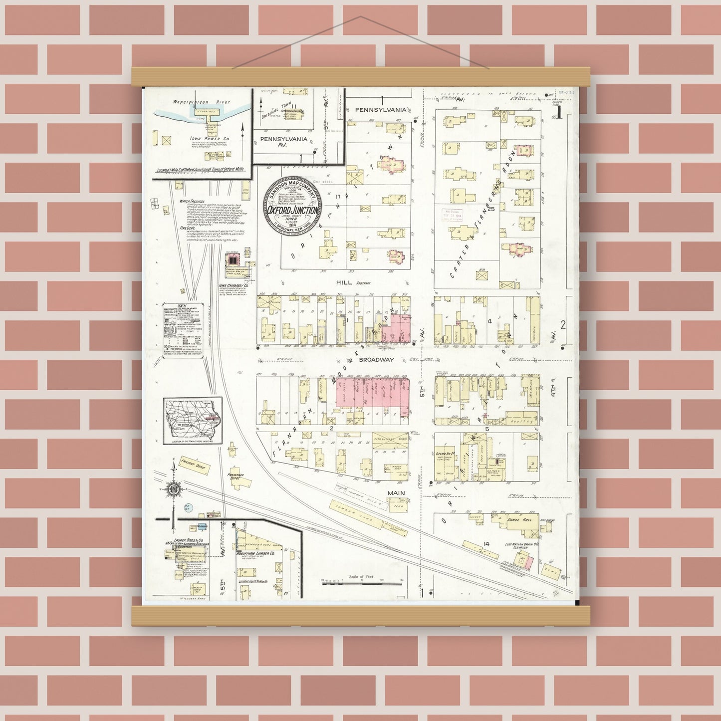 Old map wall art mockup — magnetic wood frame on brick wall — Sanborn Fire Insurance Map from Oxford Junction, Jones County, Iowa (1914), Sheet #0001