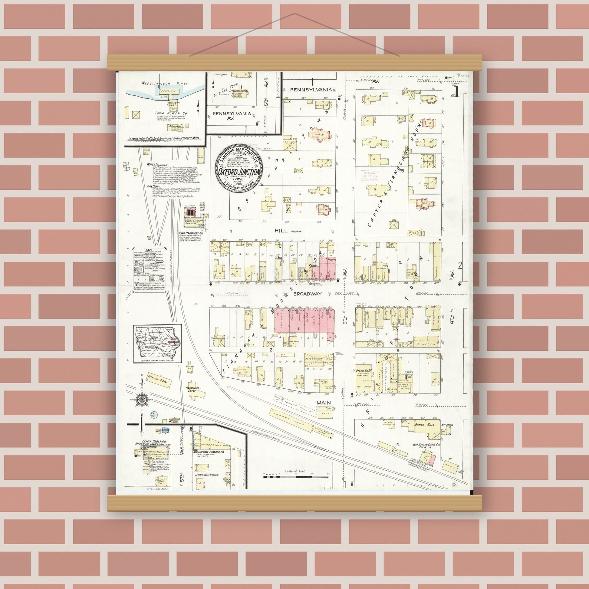 Old map wall art mockup — magnetic wood frame on brick wall — Sanborn Fire Insurance Map from Oxford Junction, Jones County, Iowa (1914), Sheet #0001