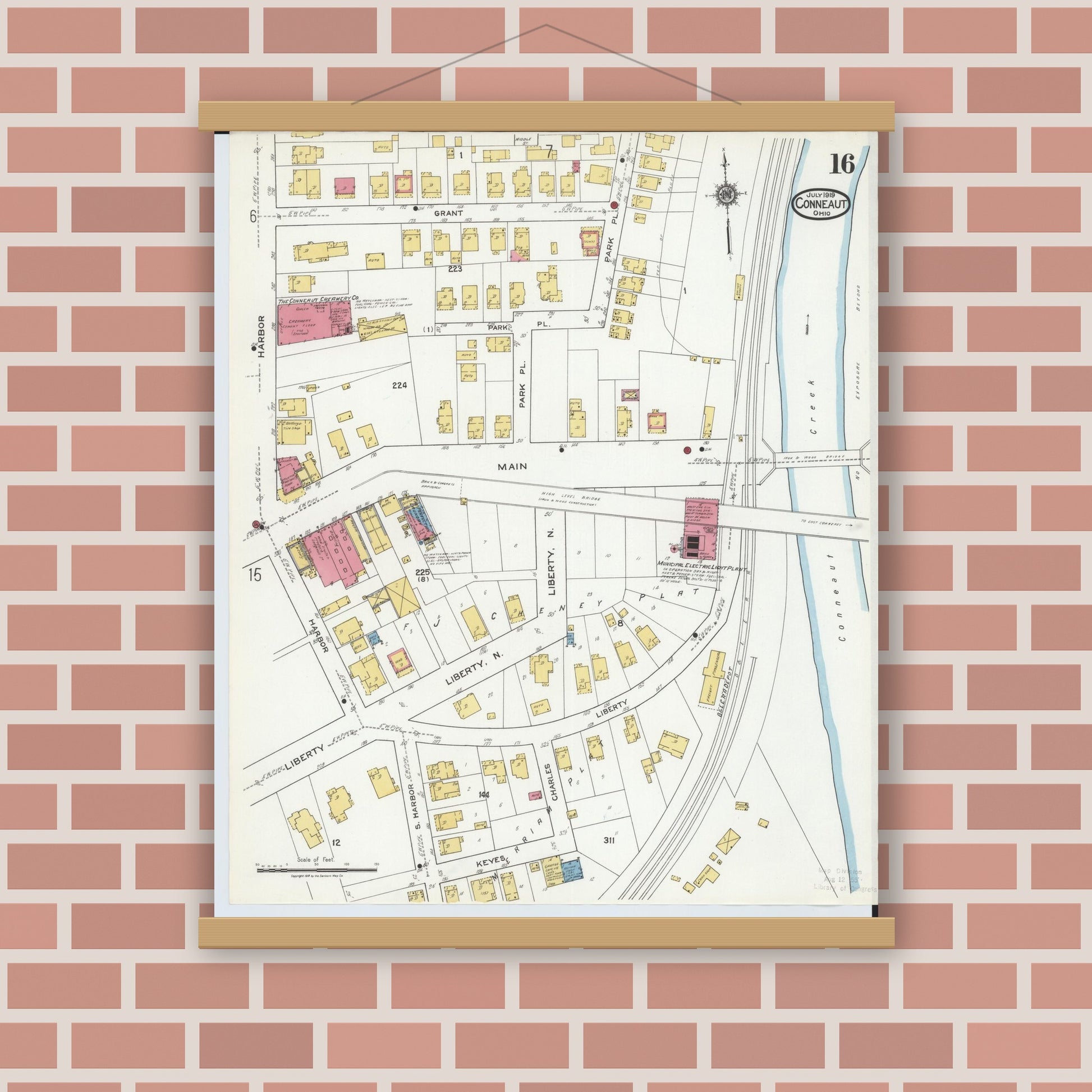 Old map wall art mockup — magnetic wood frame on brick wall — Sanborn Fire Insurance Map from Conneaut, Ashtabula County, Ohio (1919), Sheet #0016